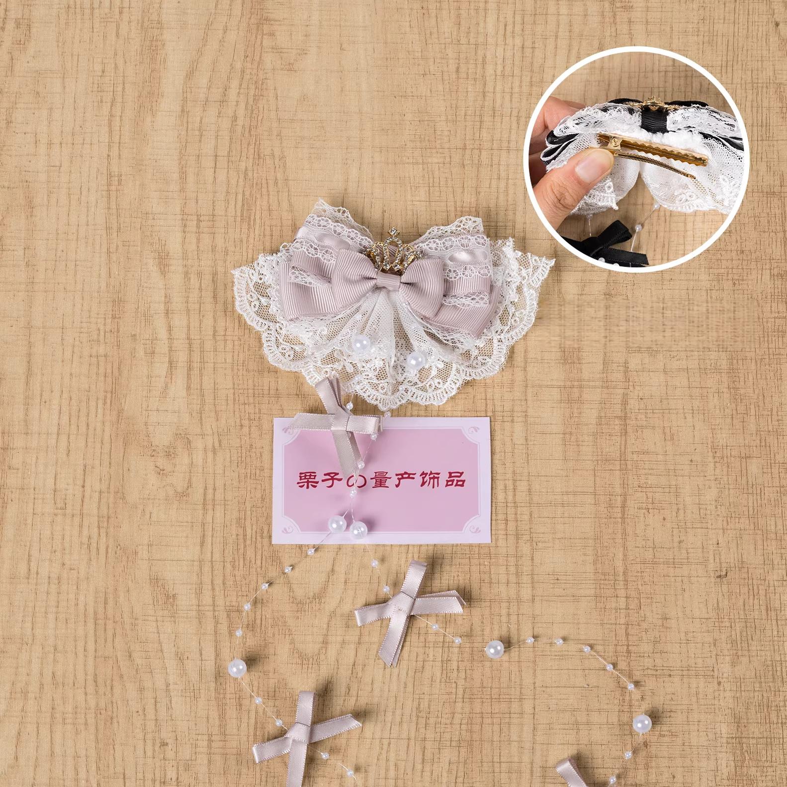 Dusty pink Jirai Kei hair clip with lace bow, rhinestone crown, and pearl tassel chains - left-facing opening variant