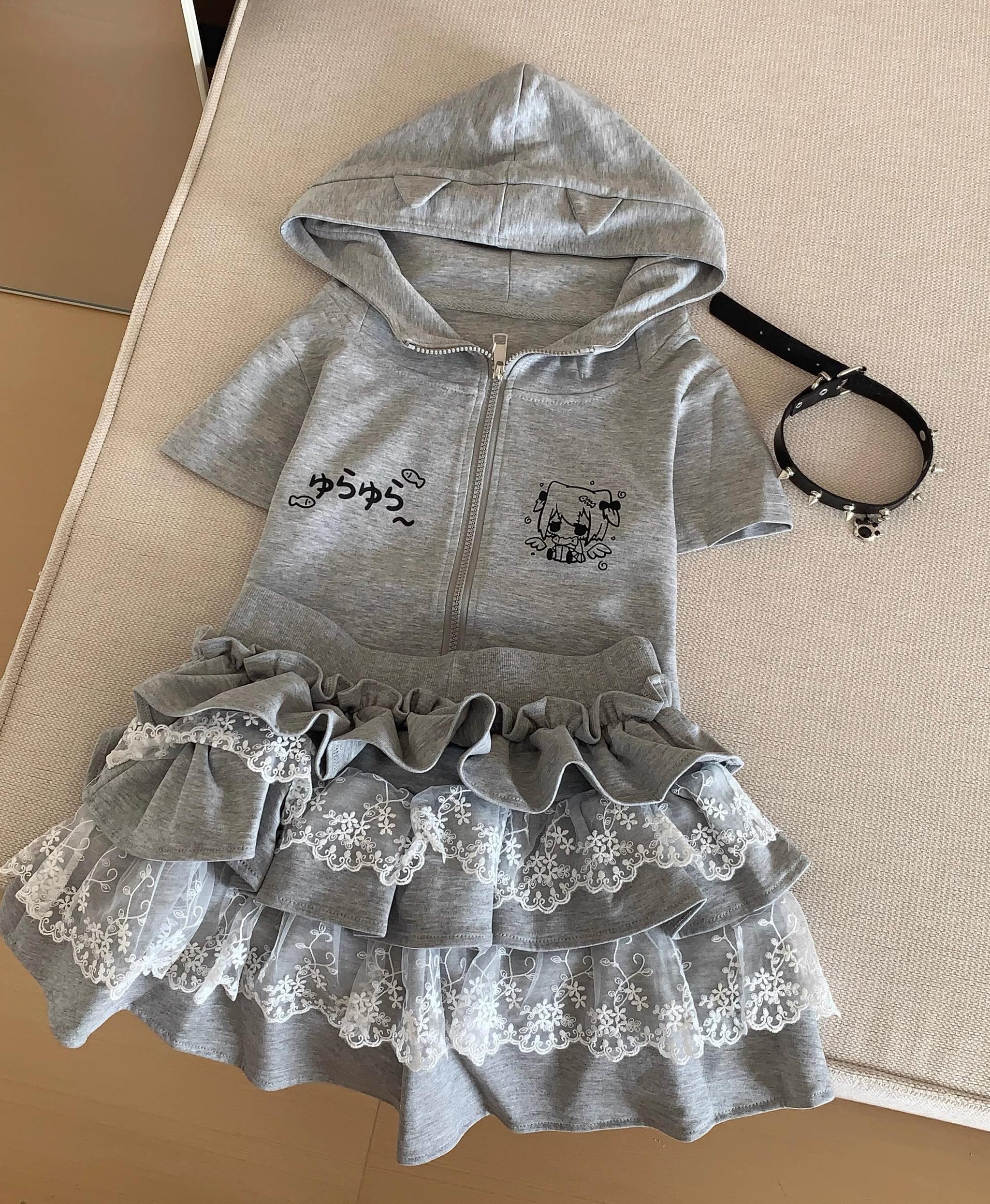 Gray Jirai Kei zip-up hoodie with bunny ears and three-tier lace ruffle cake skirt flat lay overhead view on beige cushion