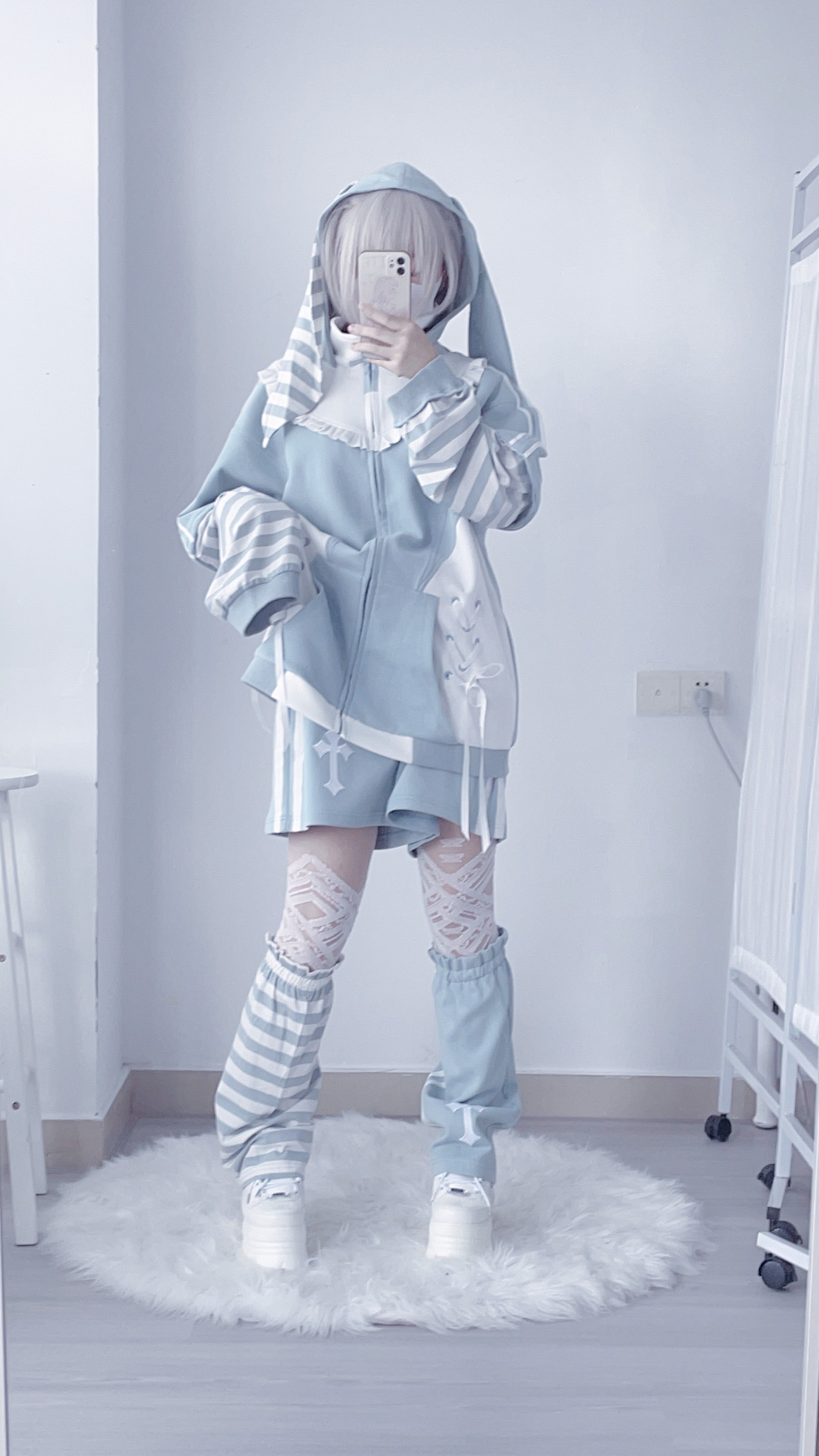 Blue and white striped detachable sleeves for Tenshi Kaiwai hoodie displayed separately showing removable construction feature