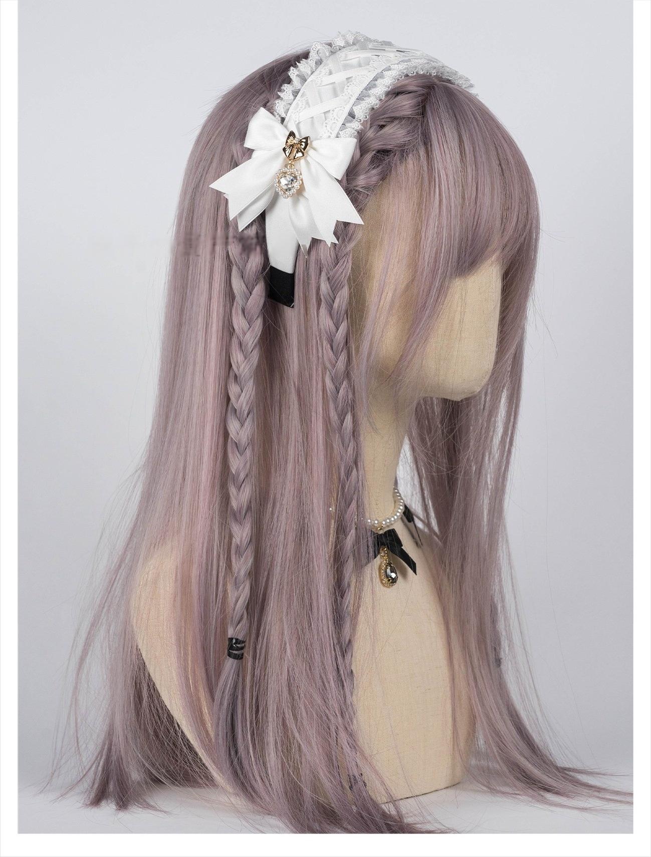 White Jirai Kei lace headband with satin bow and heart rhinestone accents displayed on mannequin with lilac braided wig, right side profile showing delicate ruffled lace texture and decorative pendants