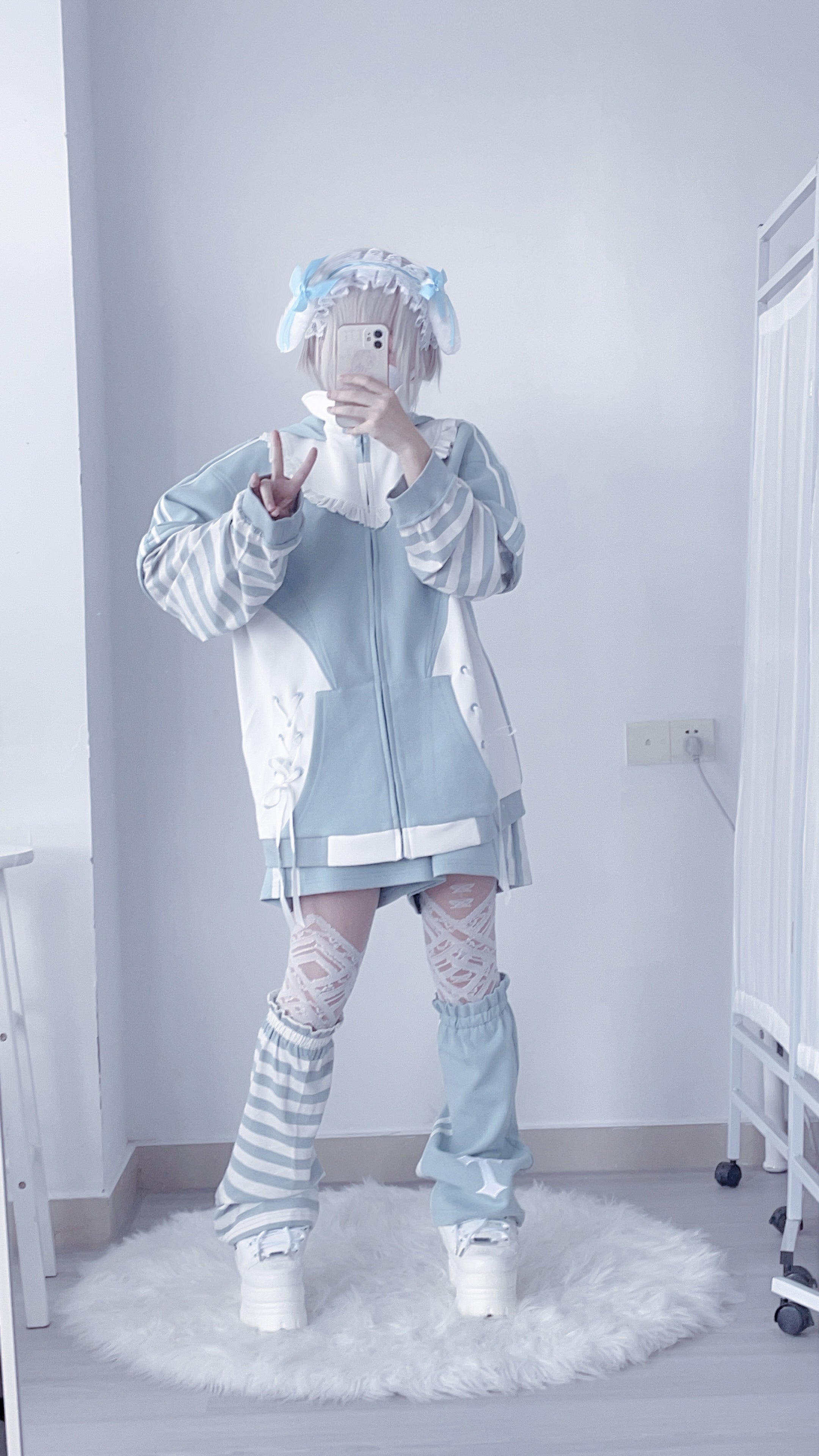 Close-up detail shot of blue Tenshi Kaiwai hoodie hood with long bunny ears and construction quality craftsmanship