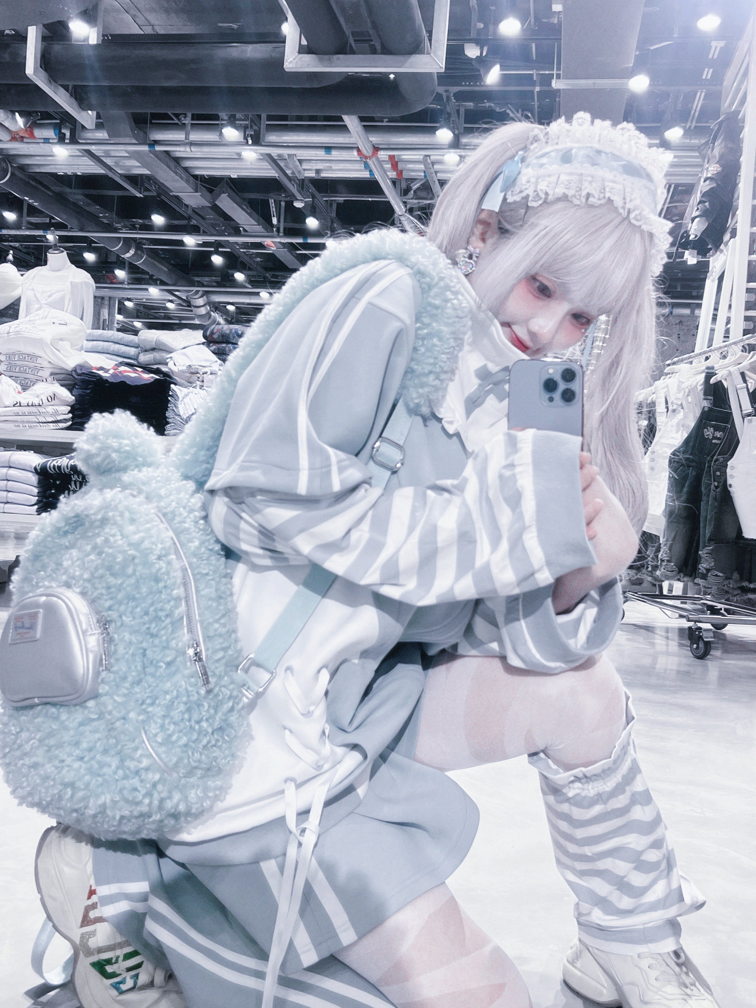 Blue Tenshi Kaiwai hoodie with asymmetrical cross straps and chest pleating design detail architectural elements
