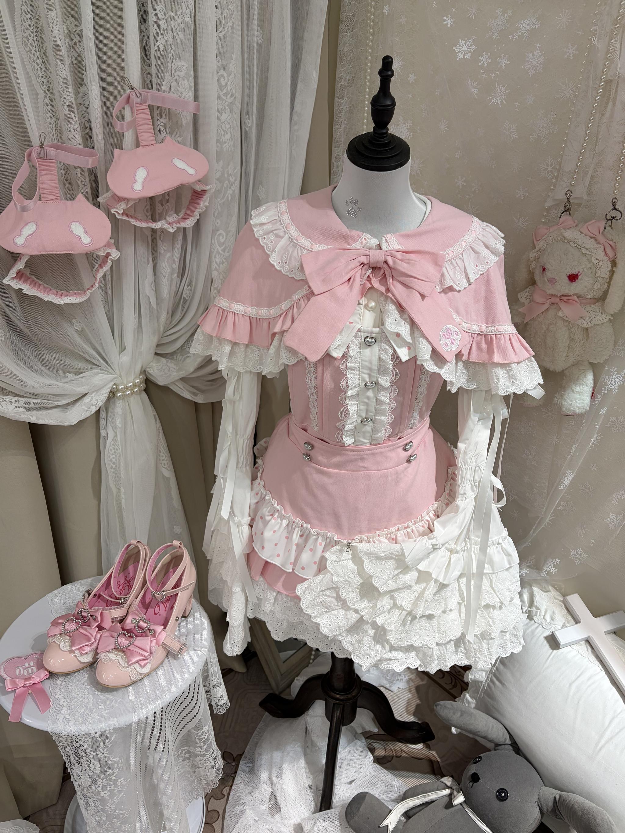 Jirai Kei pink cape with ruffled lace trim, flat lay display view showing full drape and length, one-size-fits-most capelet for sweet lolita styling