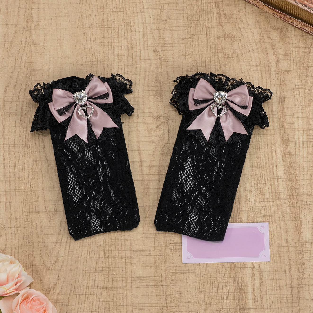 Black-purple lace knee-high Jirai Kei socks with ruffled black lace cuff, purple bow and heart rhinestone accent, full extended length