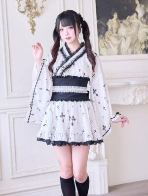 White Jirai Kei kimono blouse with cross print and black lace trim paired with white ruffle mini skirt and wide black obi belt - full front view showing complete three-piece outfit ensemble
