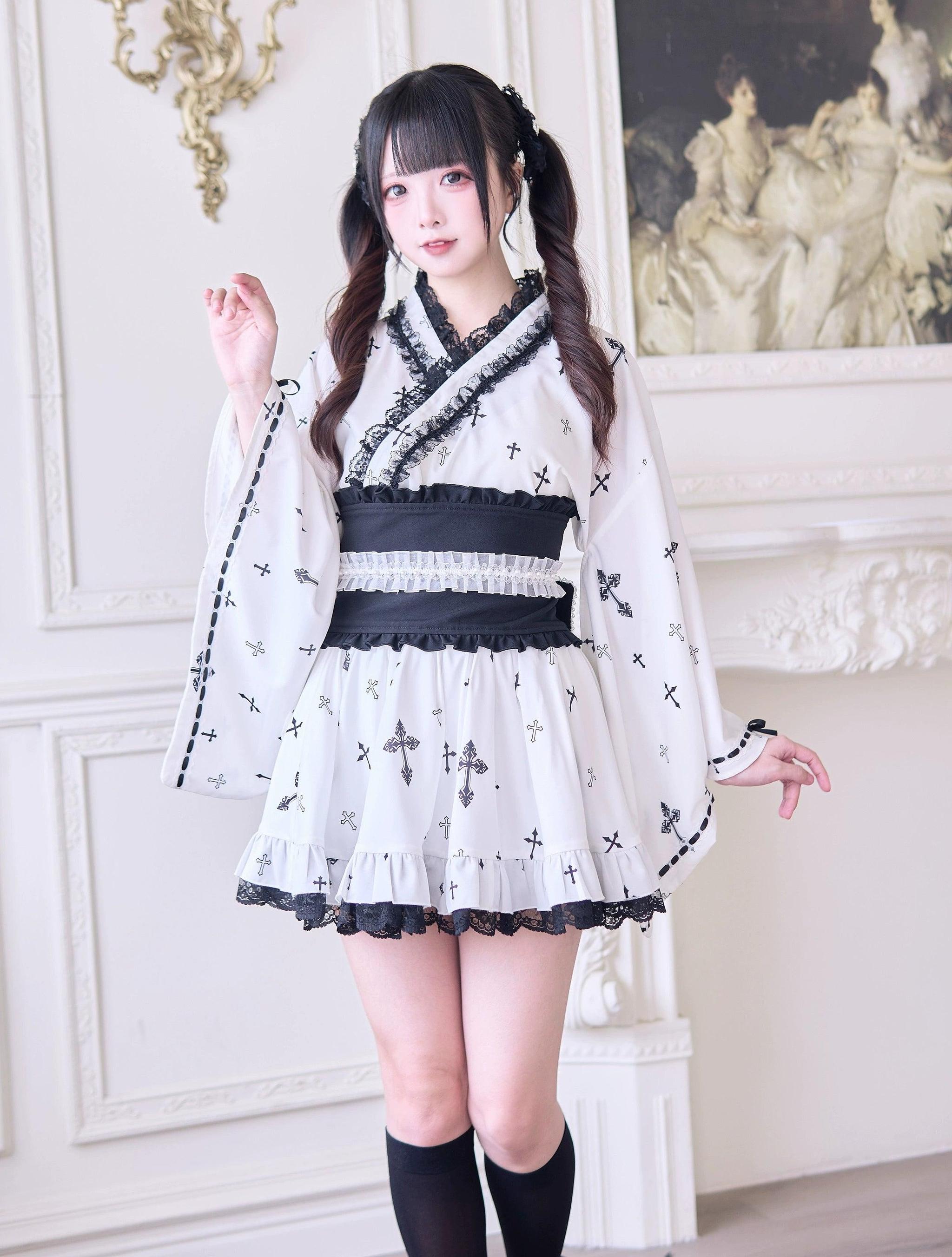 White Jirai Kei kimono blouse with cross print and black lace trim paired with white ruffle mini skirt and wide black obi belt - full front view showing complete three-piece outfit ensemble