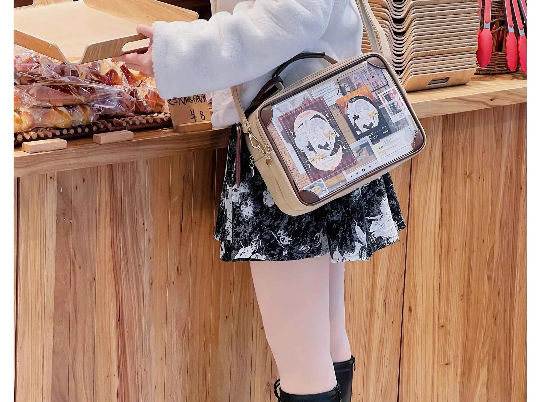 Jirai Kei itabag crossbody bag side rear view indoor bakery counter model transparent front anime prints classic two-tone leather vintage design