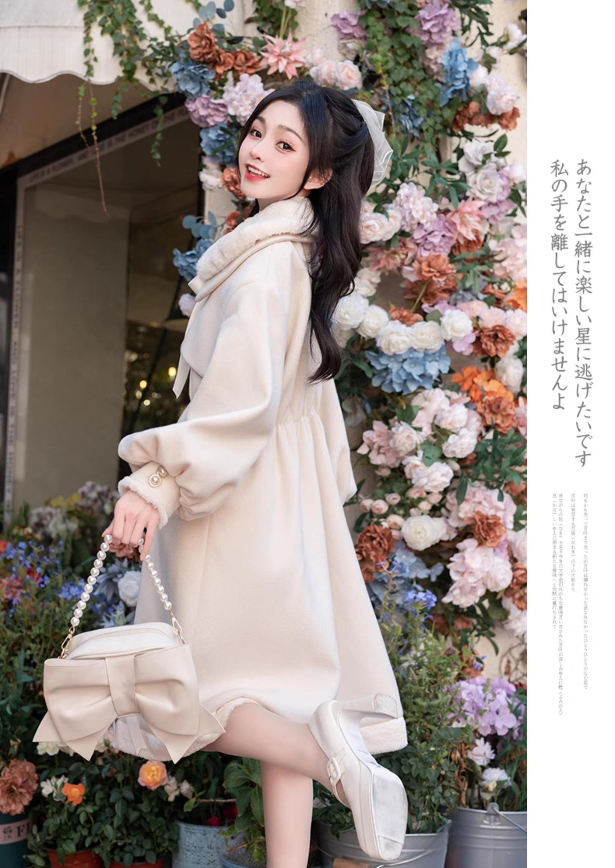 Ryousangata Jirai Kei winter coat hem and button detail - close-up of plush hem bow trims, front button closures, and decorative ribbon embellishment