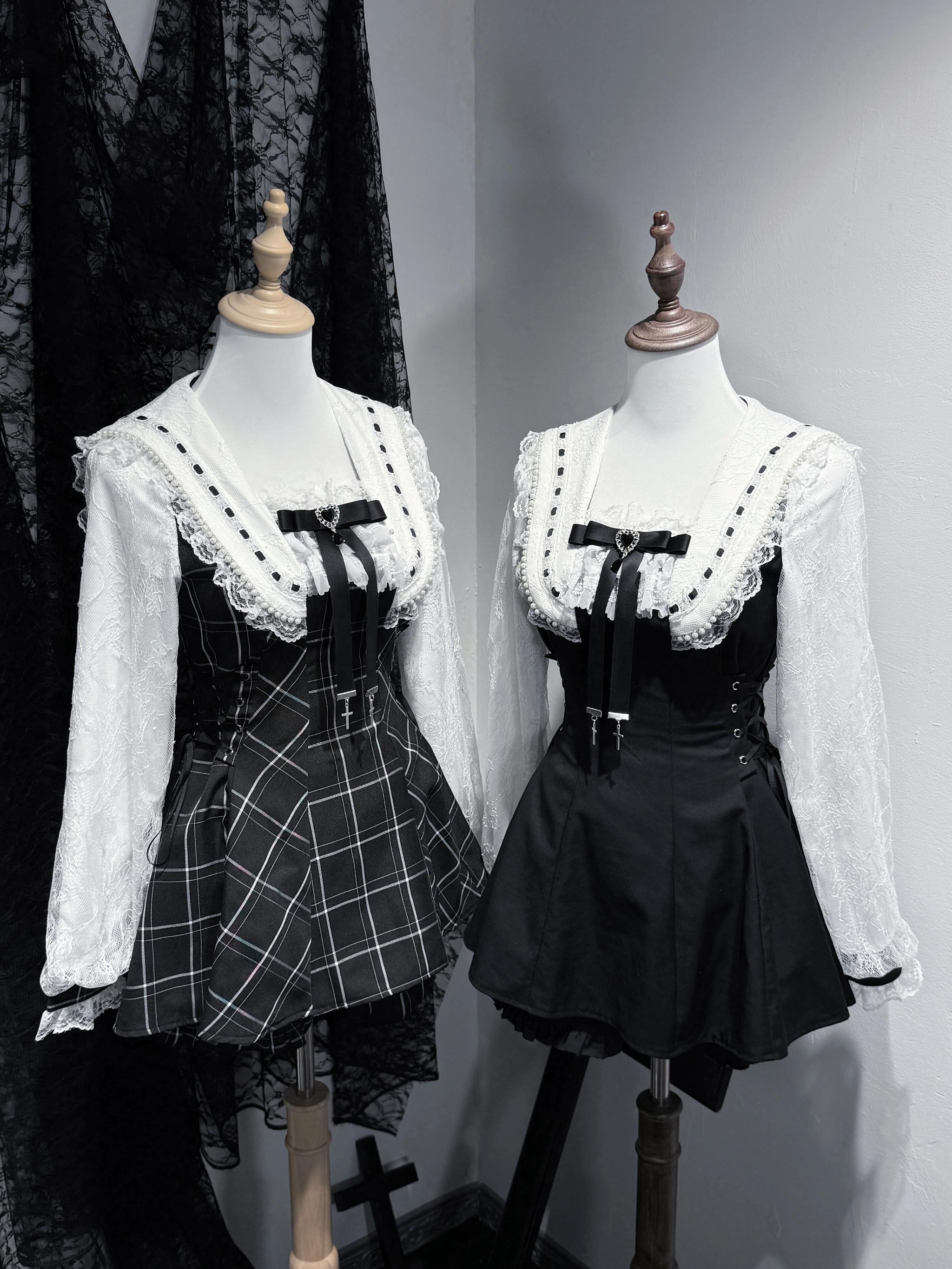 Two complete Jirai Kei two-piece outfits displayed on mannequins featuring solid black and plaid variants with lace collars and long-sleeve tops in dark studio setting