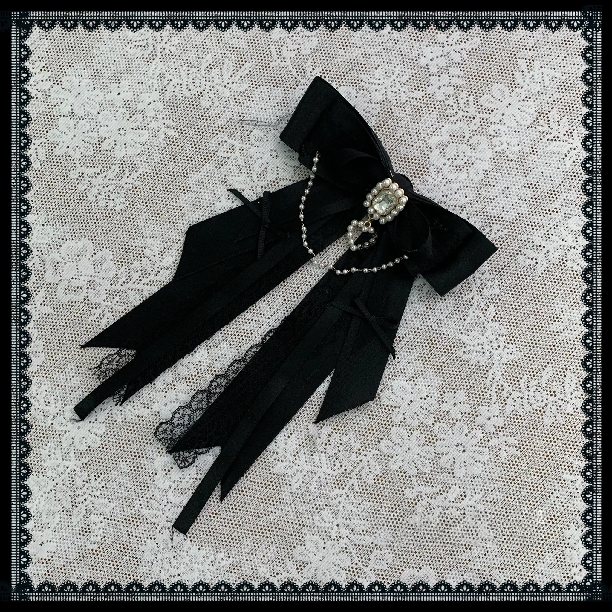 Black detachable bow tie accessory for Jirai Kei bubble skirt, size comparison and styling detail shot showing crystalline embellishments