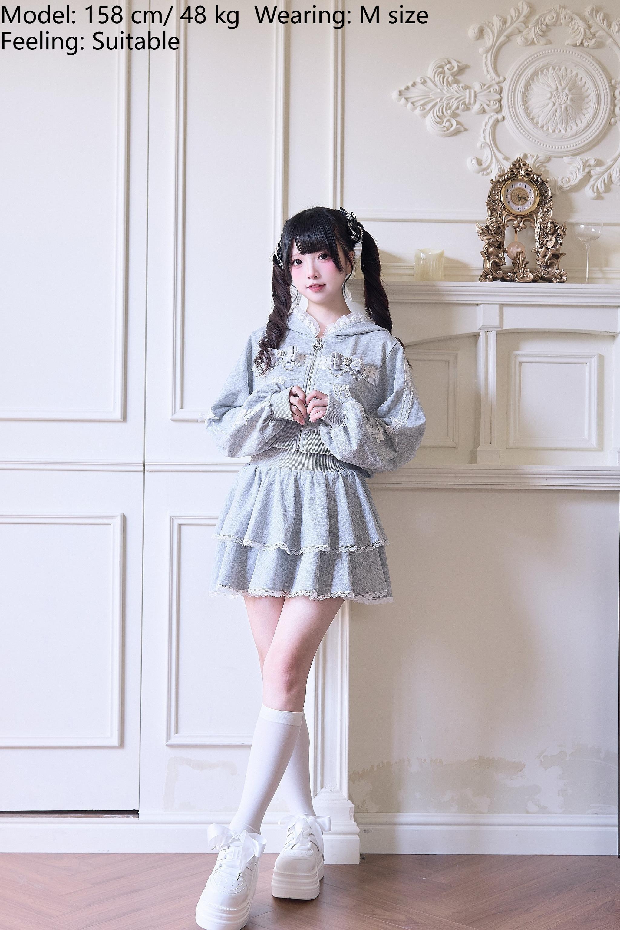 Gray Jirai Kei sport set full-body front view with hands clasped showing double-layered ruffle skirt and lace hoodie detail