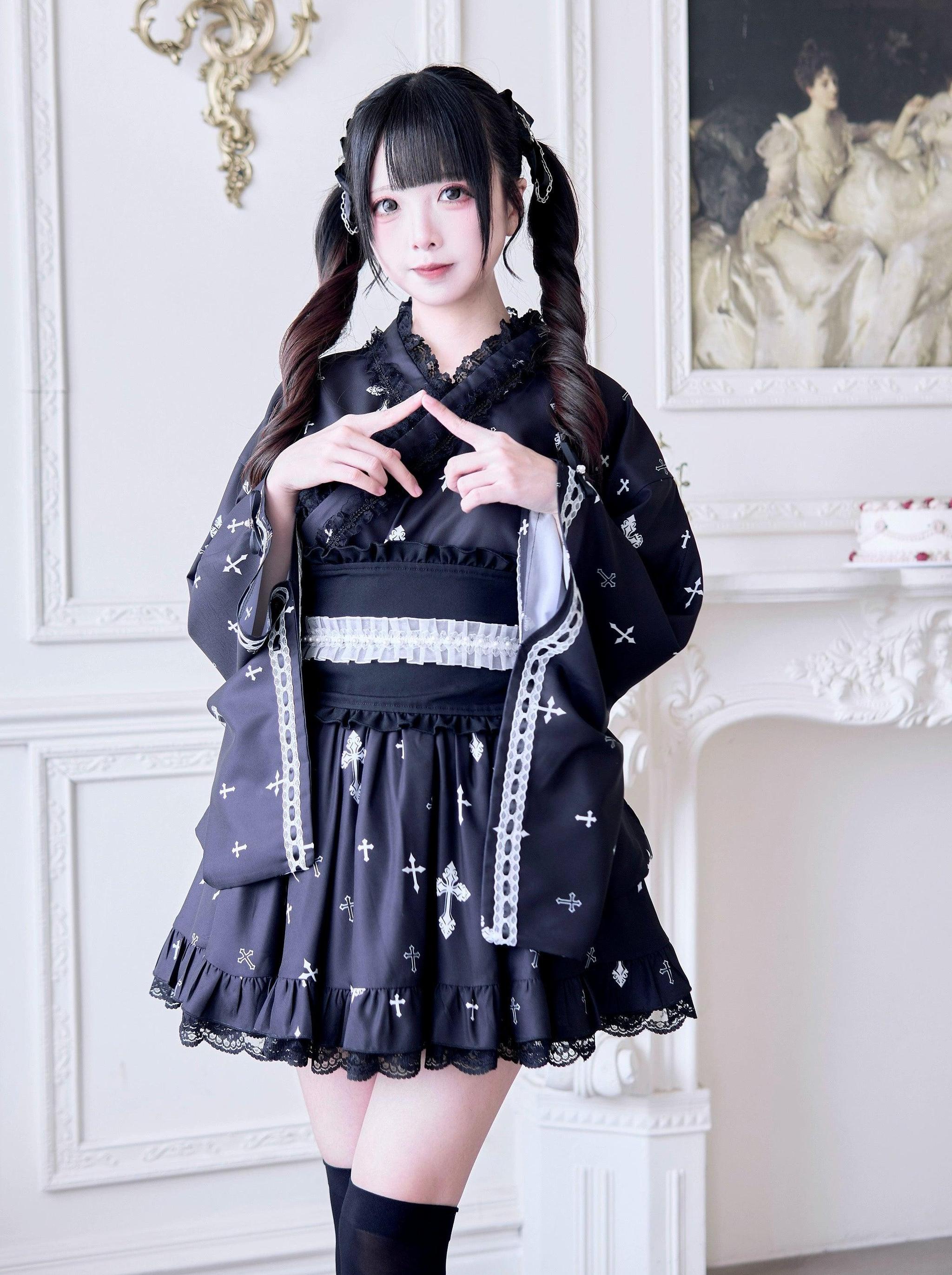 Black Jirai Kei kimono outfit with white lace accents and cross pattern - full body front shot featuring twin-tailed model wearing ruffle skirt hem and wide waist belt