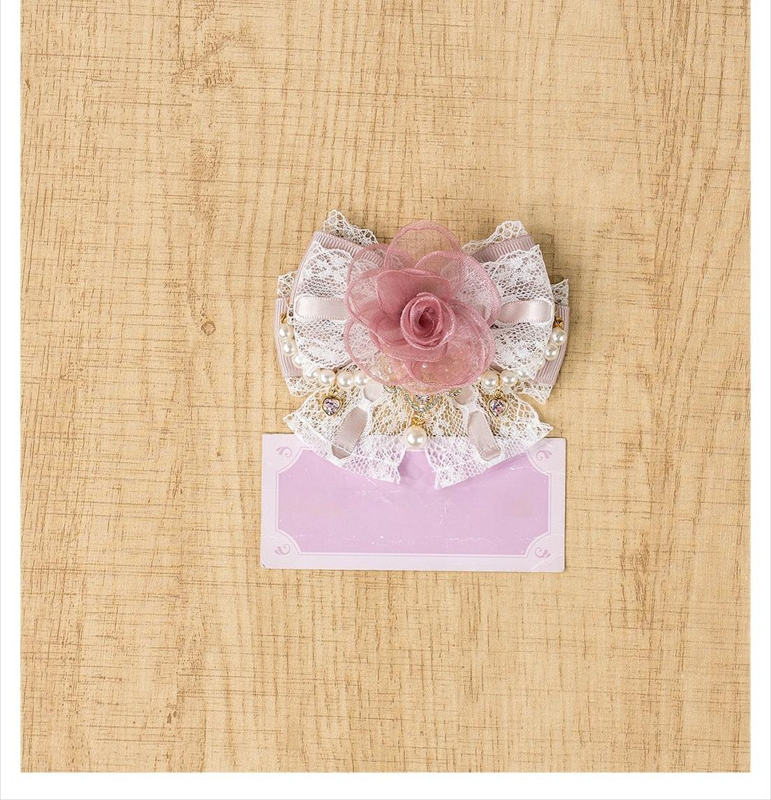 Single pink rose hair clip with multi-layer tulle construction pearl accents and delicate lace bow base