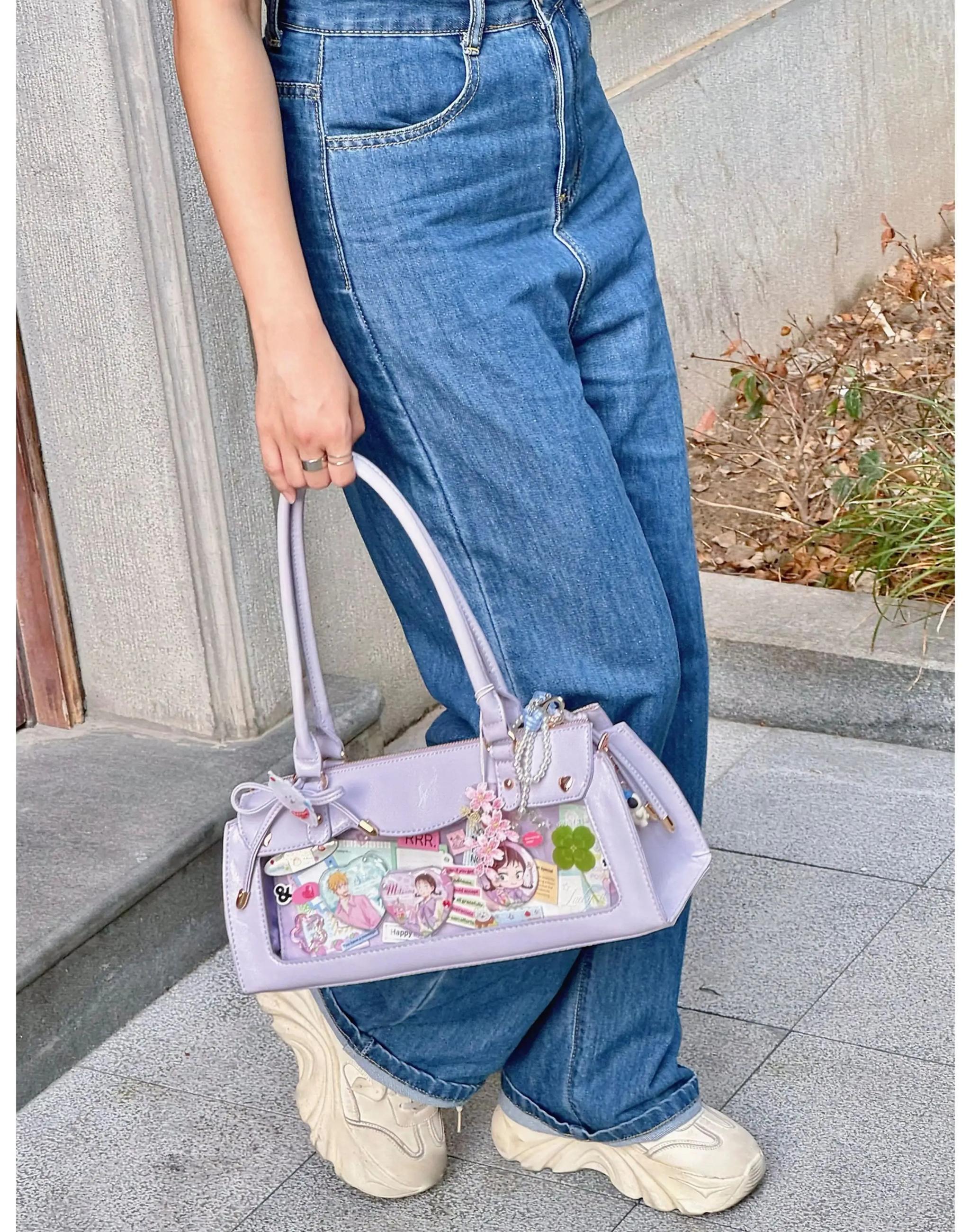 Baguette itabag detachable crossbody strap attachment mechanism and adjustable length feature demonstration
