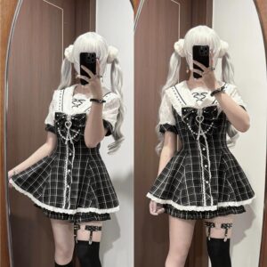Plaid Jirai Kei dress with pearl chain rhinestone bow mirror selfie three quarter view twin tail cosplayers black white grid pattern sailor collar thigh straps