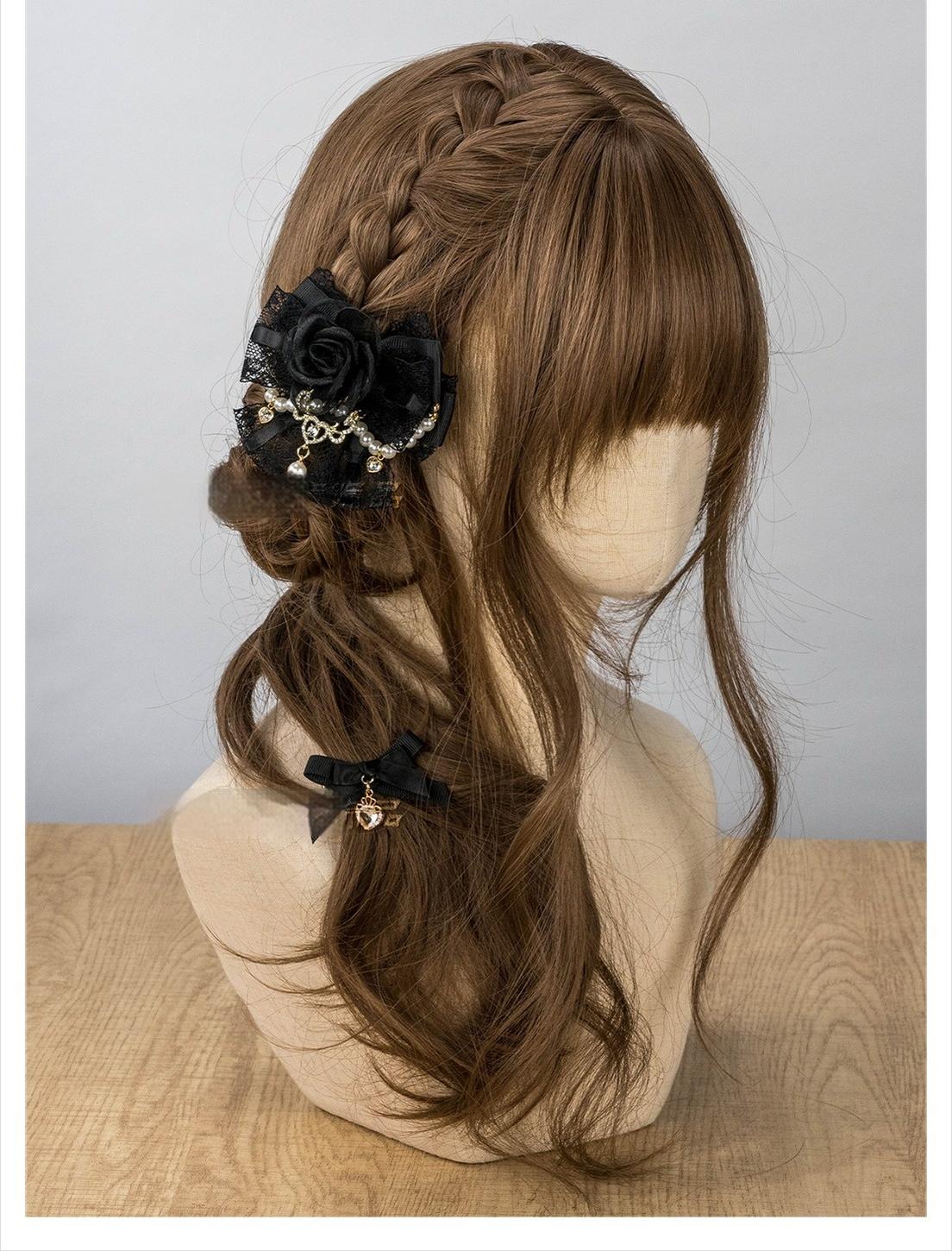 Black Jirai Kei rose hair clip with lace bow and pearl chain displayed on mannequin braided hair side view