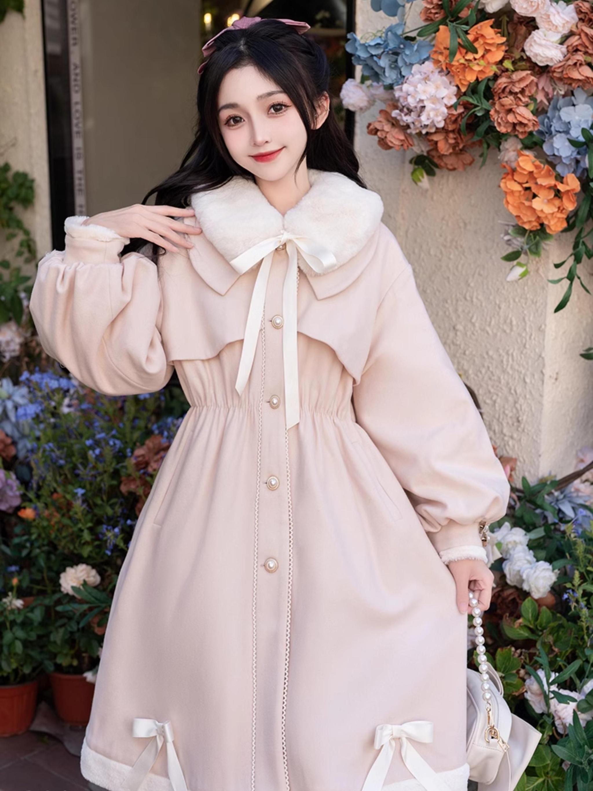 Light pink Ryousangata Jirai Kei winter coat front full-body shot - girl with dark hair accessory wearing padded coat with faux fur collar and front ribbon tie detail