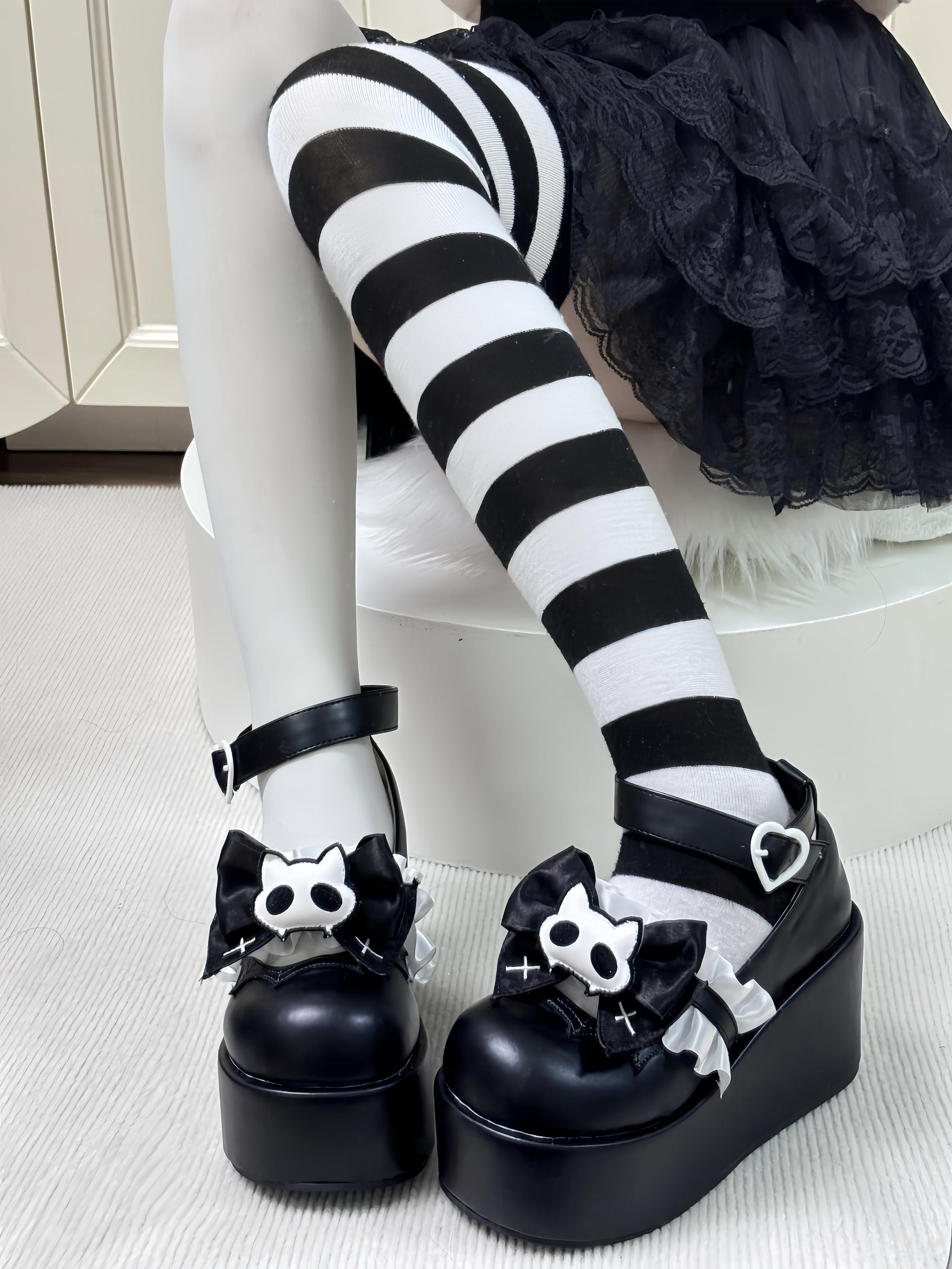 Black gothic platform shoes with removable bow accessories Jirai Kei fashion statement piece styling inspiration