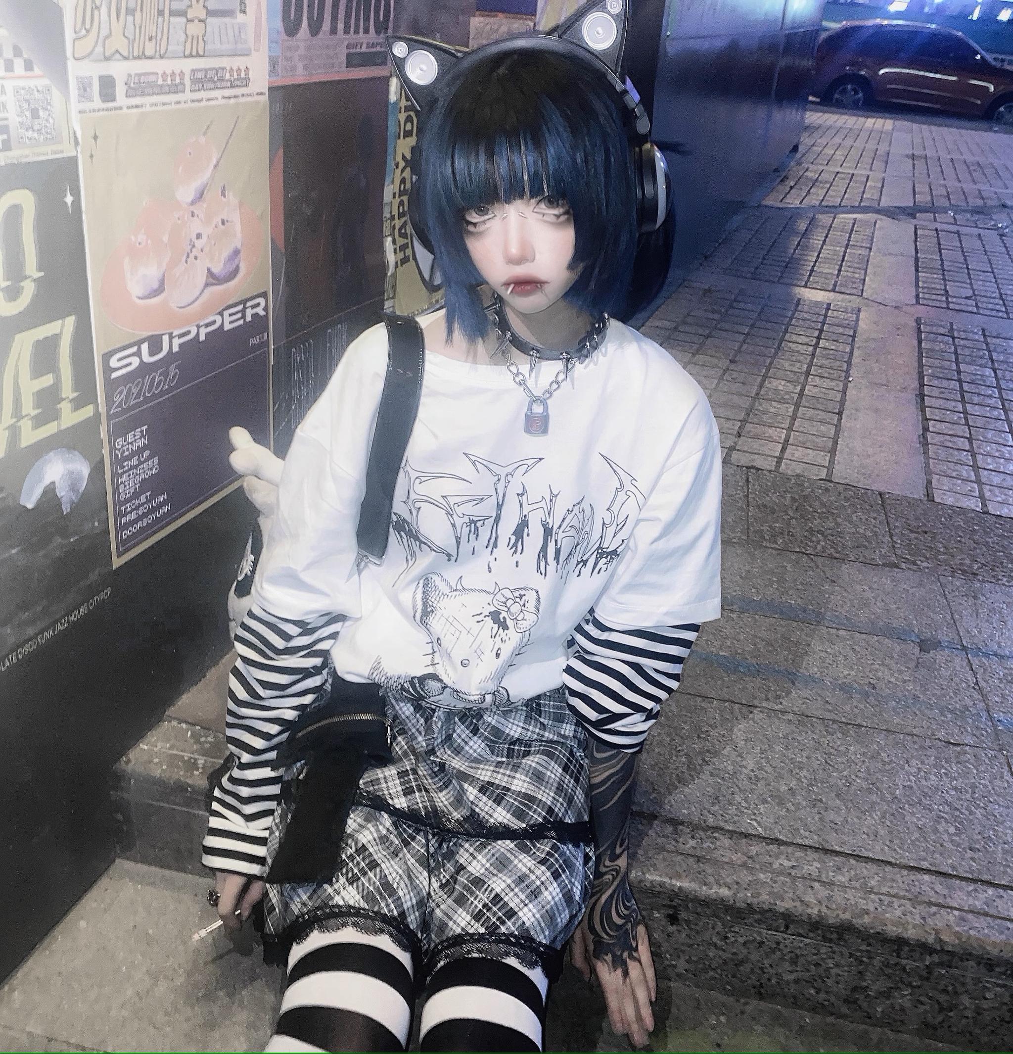 Jirai kei striped punk tee false two-piece construction layering effect shown in lifestyle photography setting