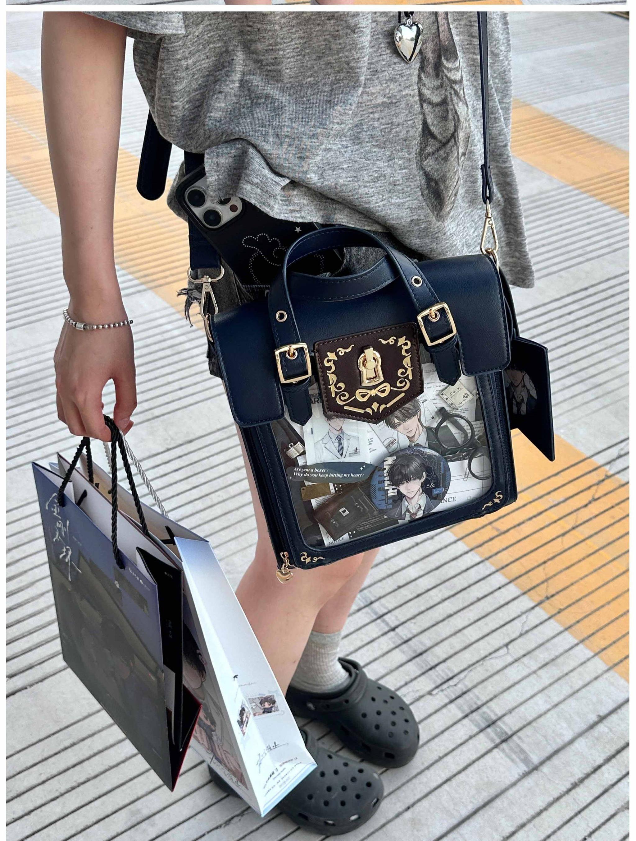 Vintage Jirai Kei embroidered ita bag display showing clear acrylic window with anime badge collection arrangement and detachable crossbody strap functionality