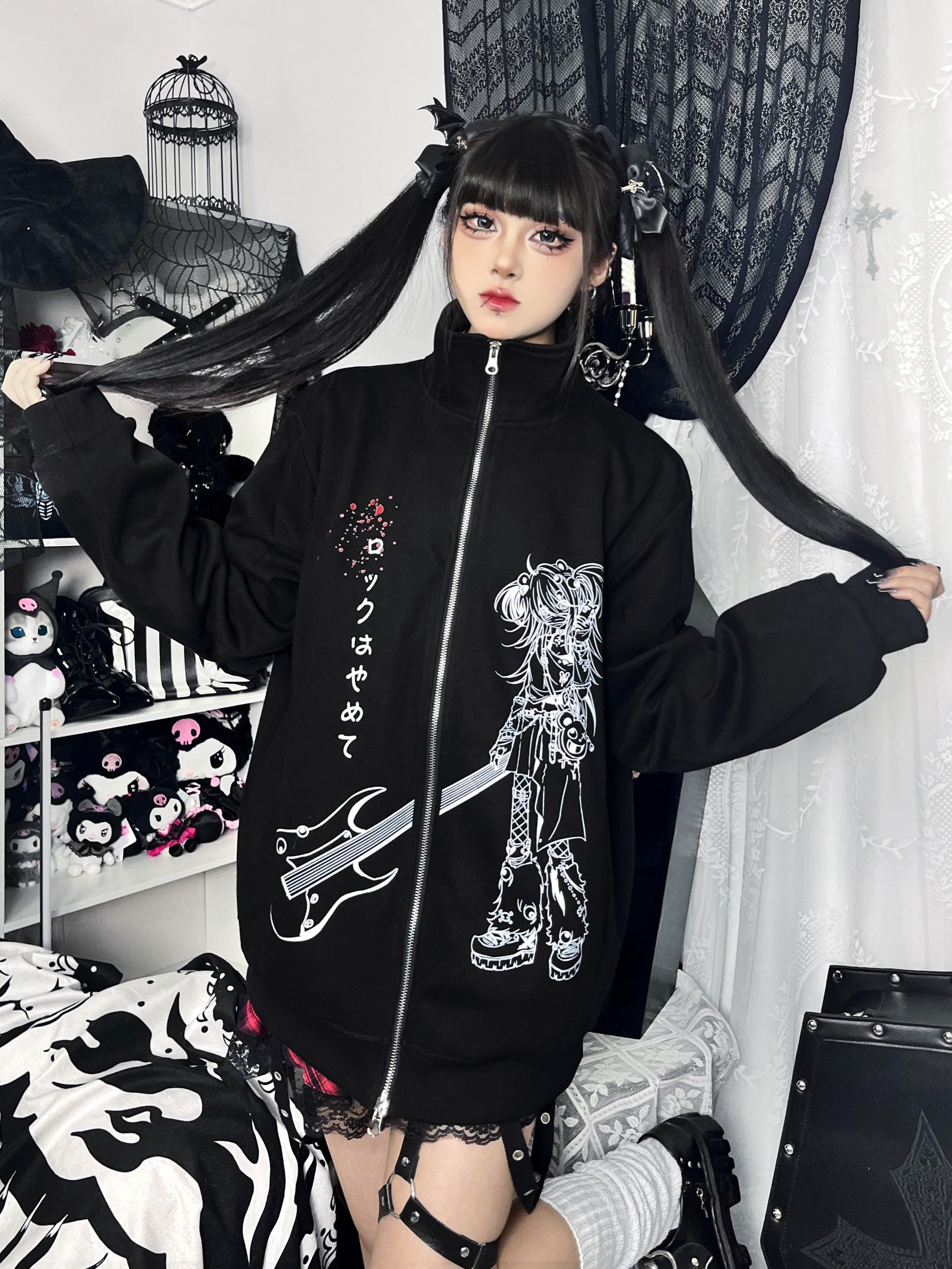 Oversized Jirai Kei anime hoodie front shot on double ponytail model with loose sleeve cuffs in rock-themed bedroom