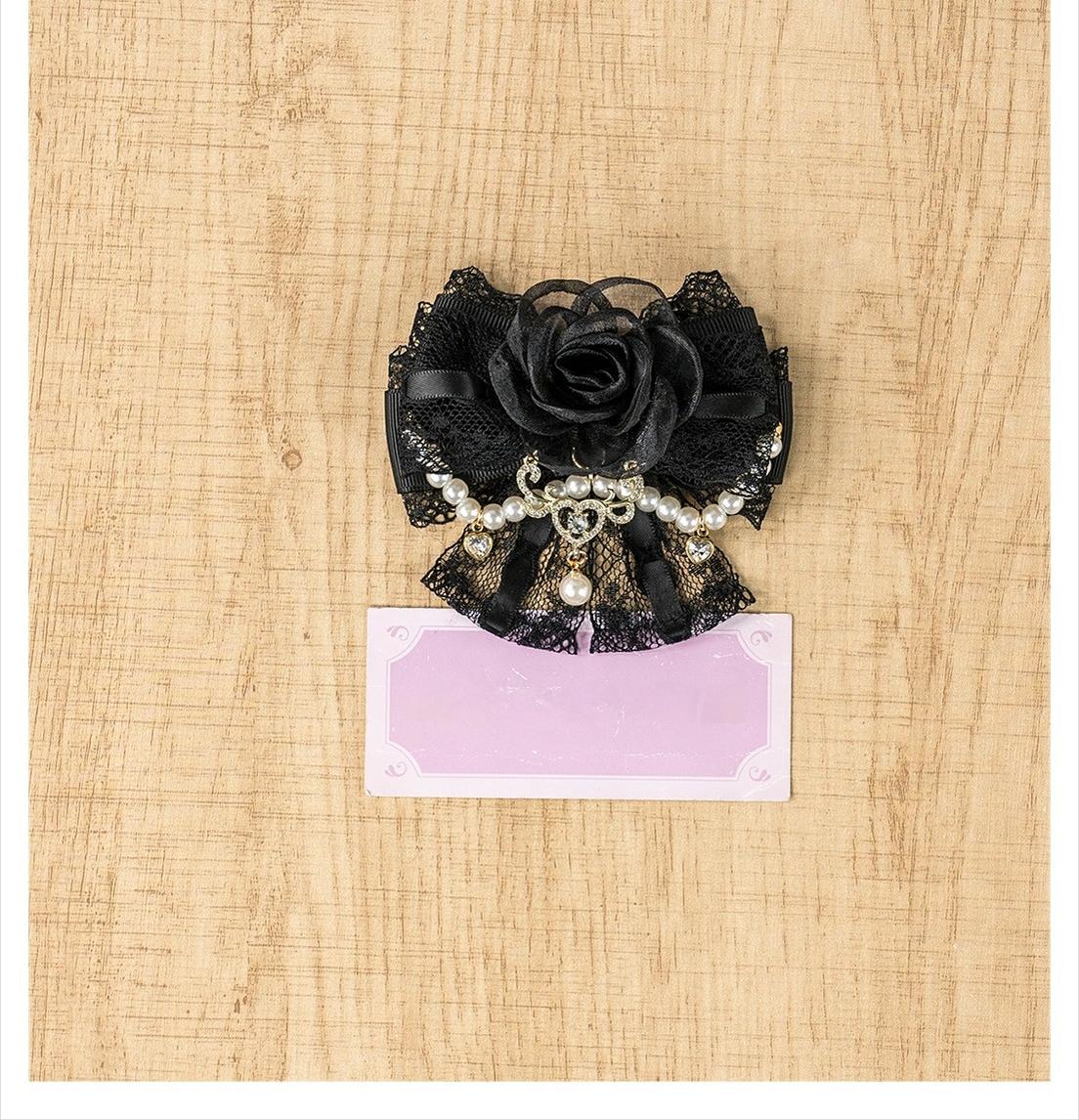 Single black rose hair clip with lace base rose flower and pearl chain pendant on wooden table flat lay