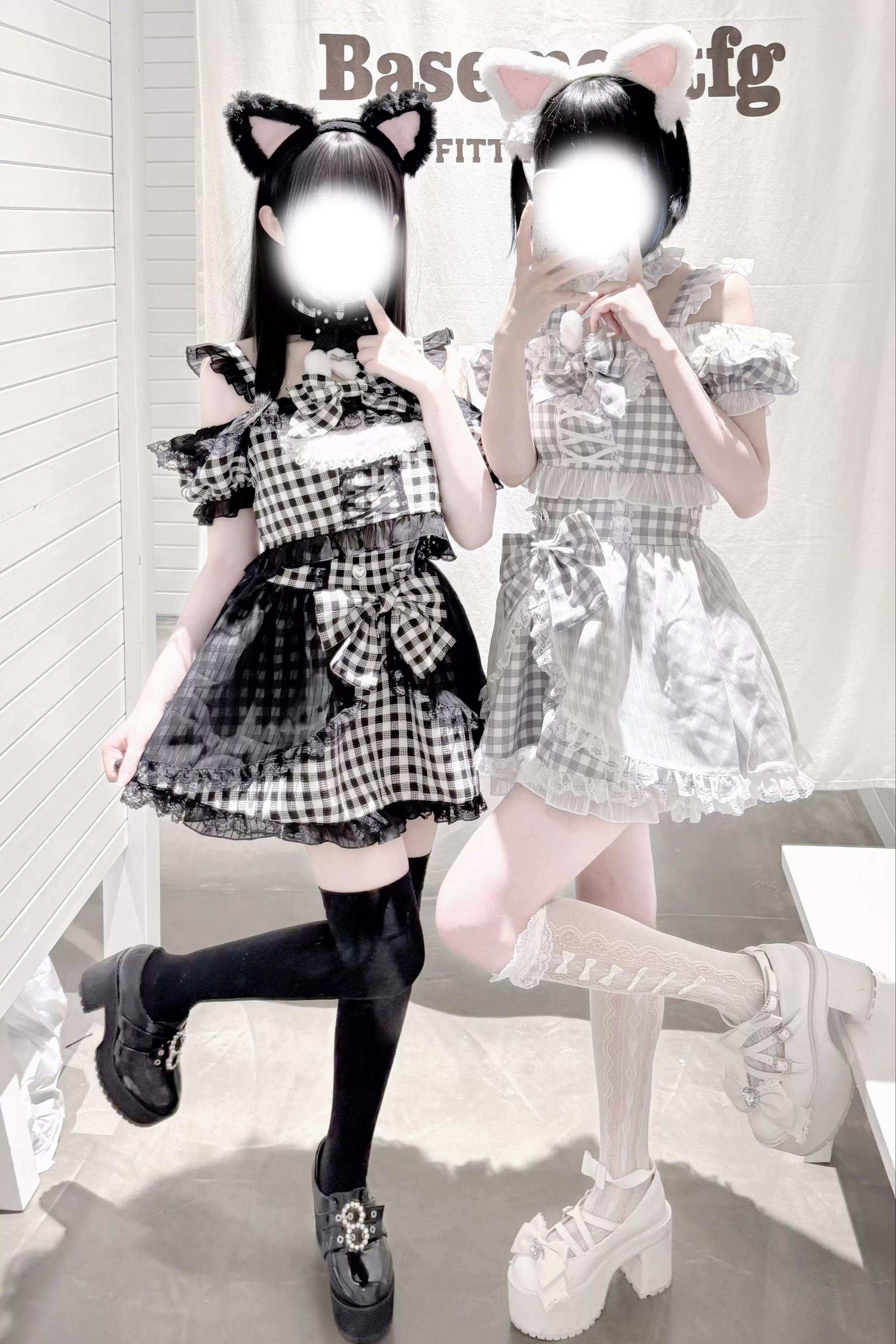 Dynamic full body front view of girl wearing cat ear jirai kei lolita maid outfit with ruffled short skirt and matching hair accessories indoors
