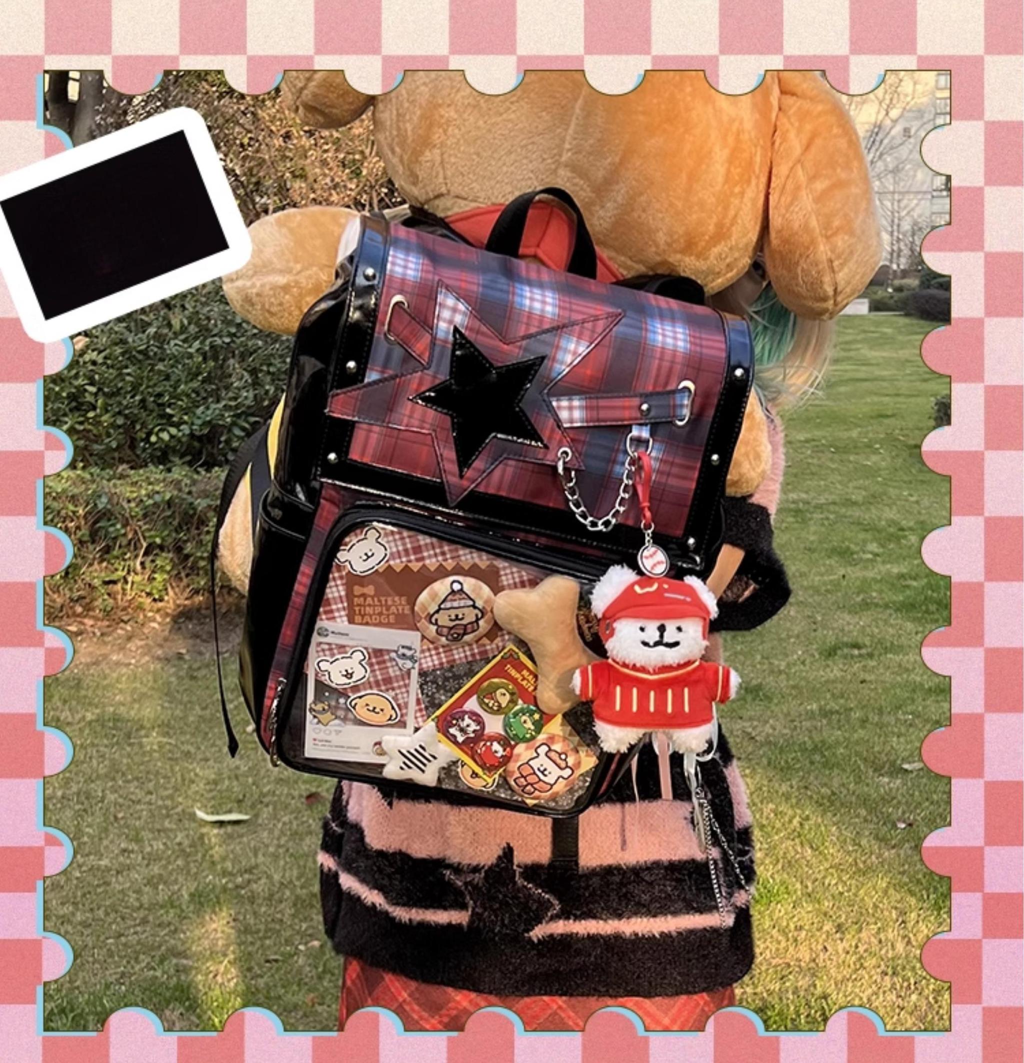Red tartan ita backpack back view outdoors on lawn with plush dog charm and anime badge display window