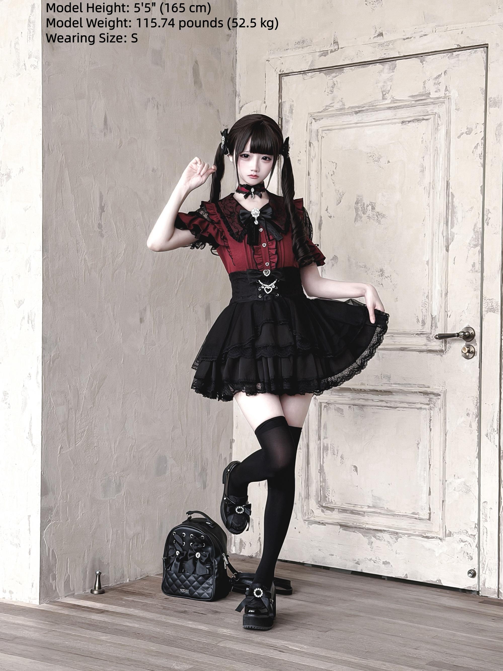 Red and black Jirai Kei lace blouse with black thigh highs and lace hem skirt crossbody leather bag