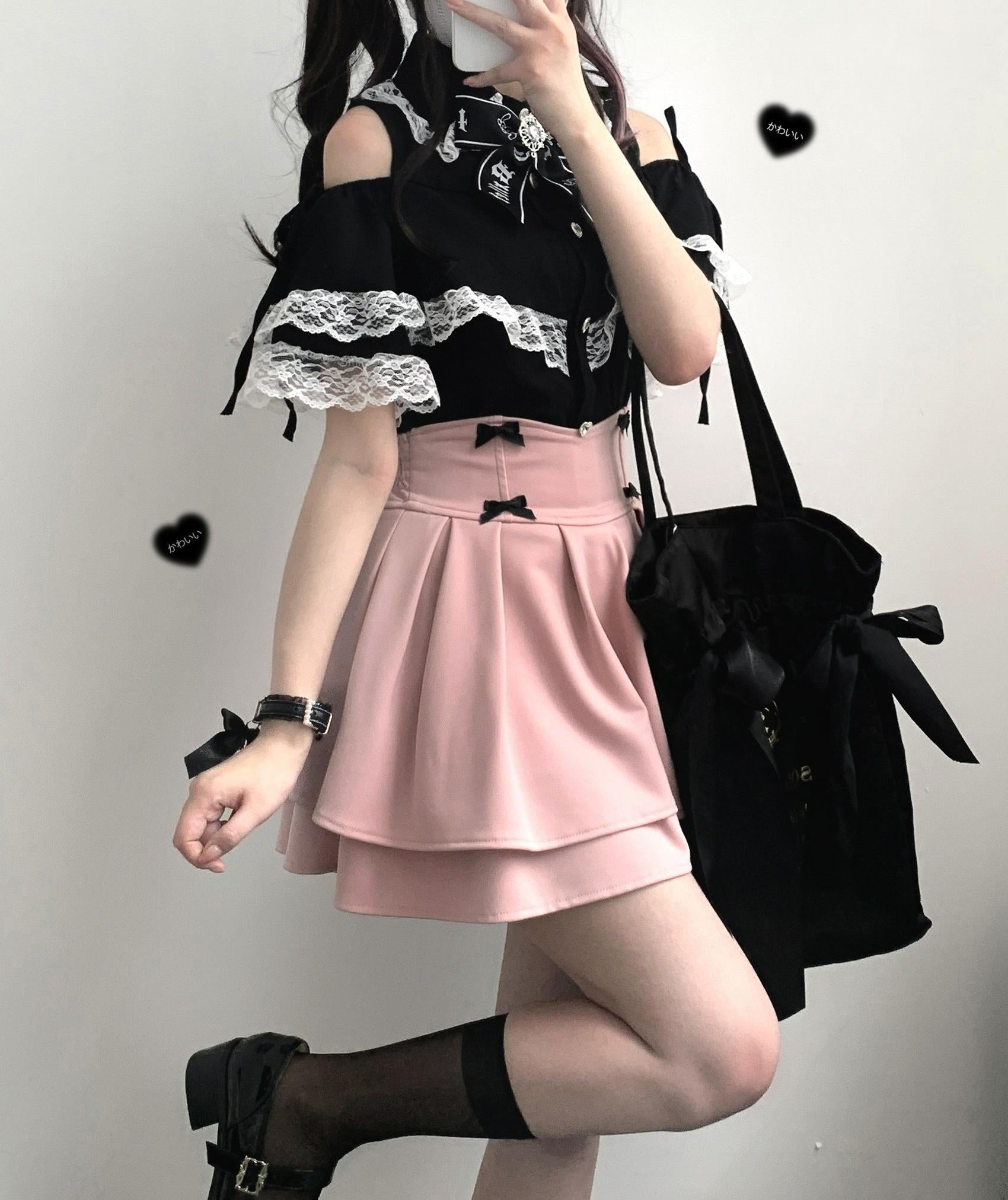 Half-body view of black Jirai Kei lace off-shoulder blouse with heart-shaped buttons and corset waist styling
