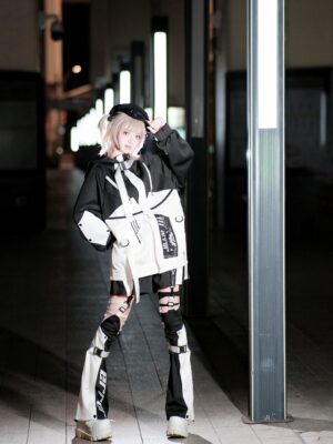 Black white cyberpunk jirai kei streetwear set on model with ripped leg covers color block design and strappy harness details night street aesthetic
