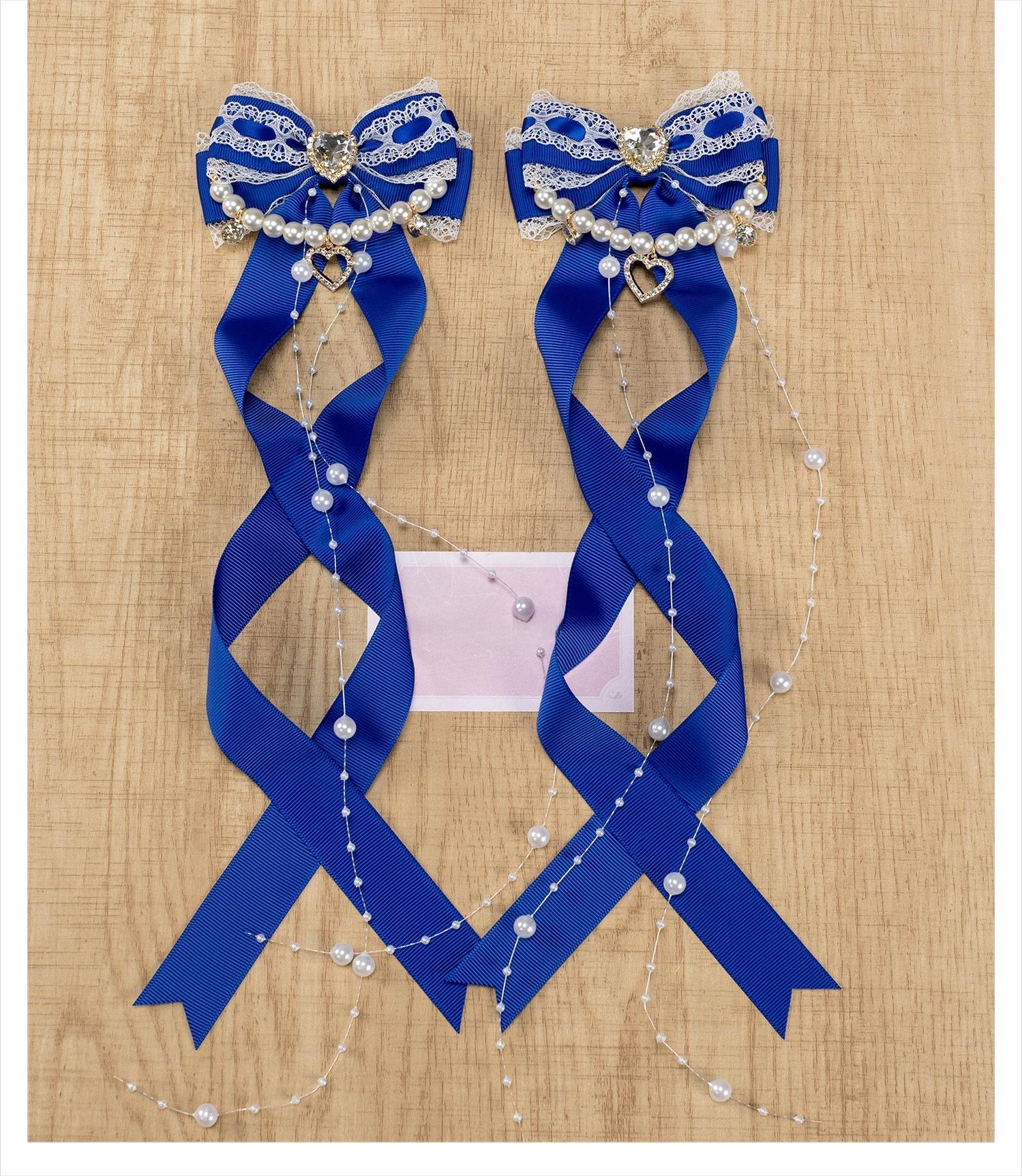 Jirai Kei royal blue bow hair clips with rhinestone heart and pearl chain embellishment product photography