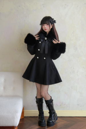 Black Jirai Kei faux fur collar winter coat front view on model showcasing cinched waist silhouette and flared hem detail
