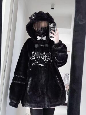 Black Jirai Kei hooded coat with puppy ear accents and white gothic graphic print, studded trims, and cross decoration on hood - front selfie detail view