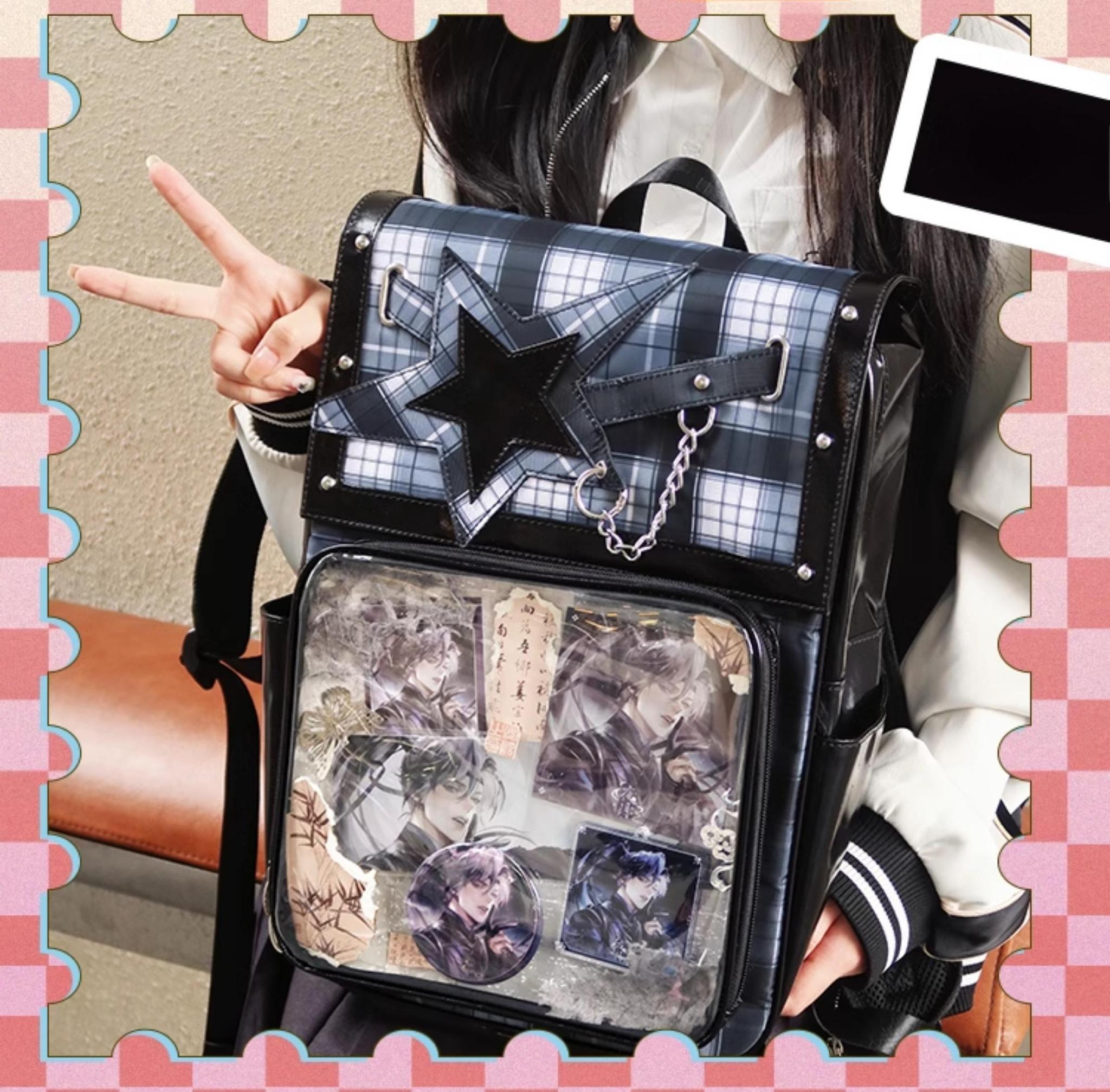 Red-black tartan star ita backpack packed with collectible anime figures and acrylic stands display