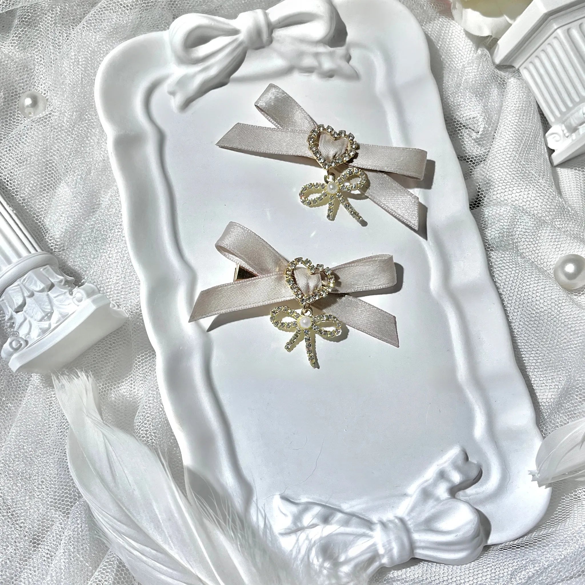 Dusty pink swallowtail bow hair clips Jirai Kei collection with rhinestone center heart pendant romantic feminine design