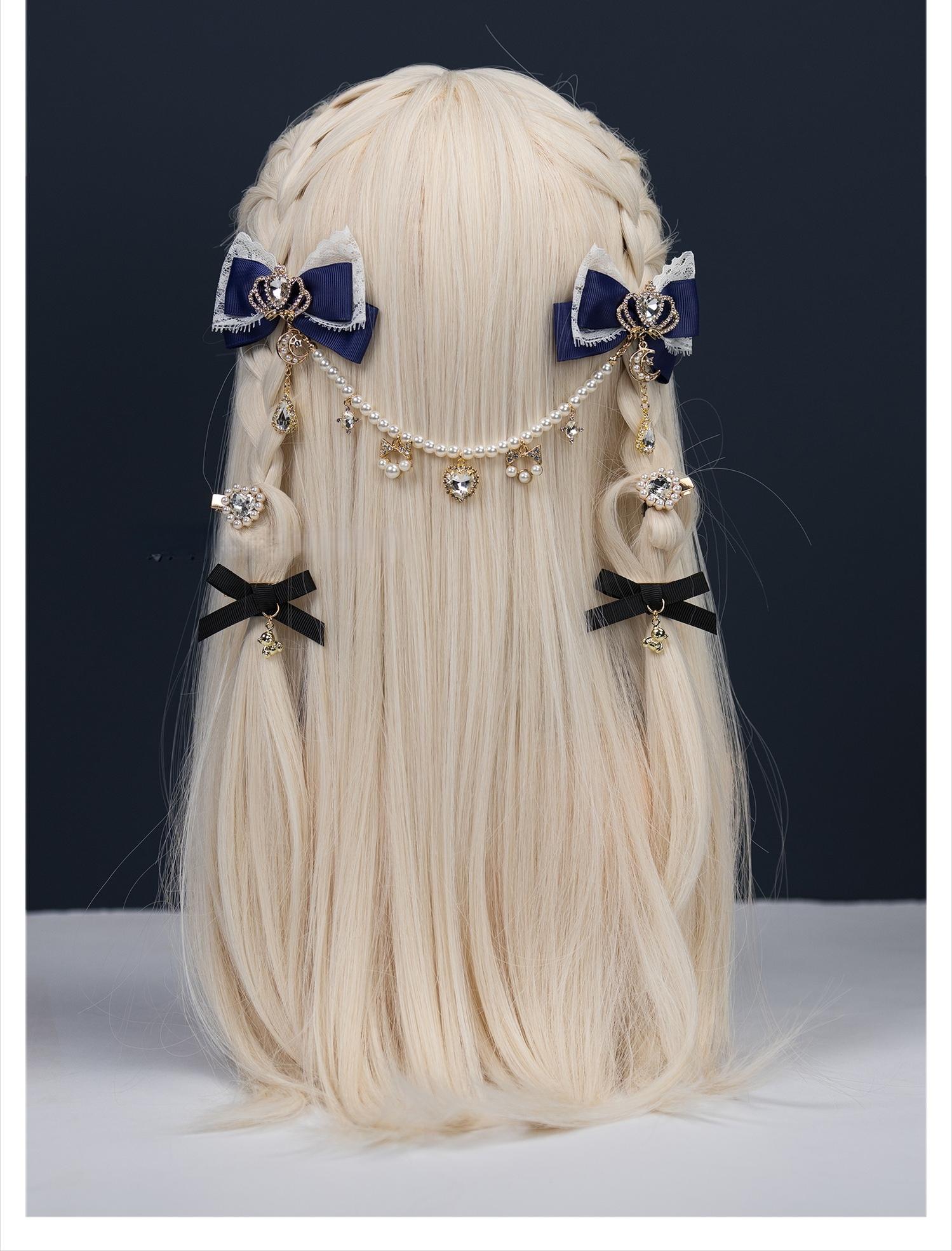 Navy blue Jirai Kei bow hair clips back view on blonde mannequin with heart-shaped rhinestones and pearl rhinestone forehead chain