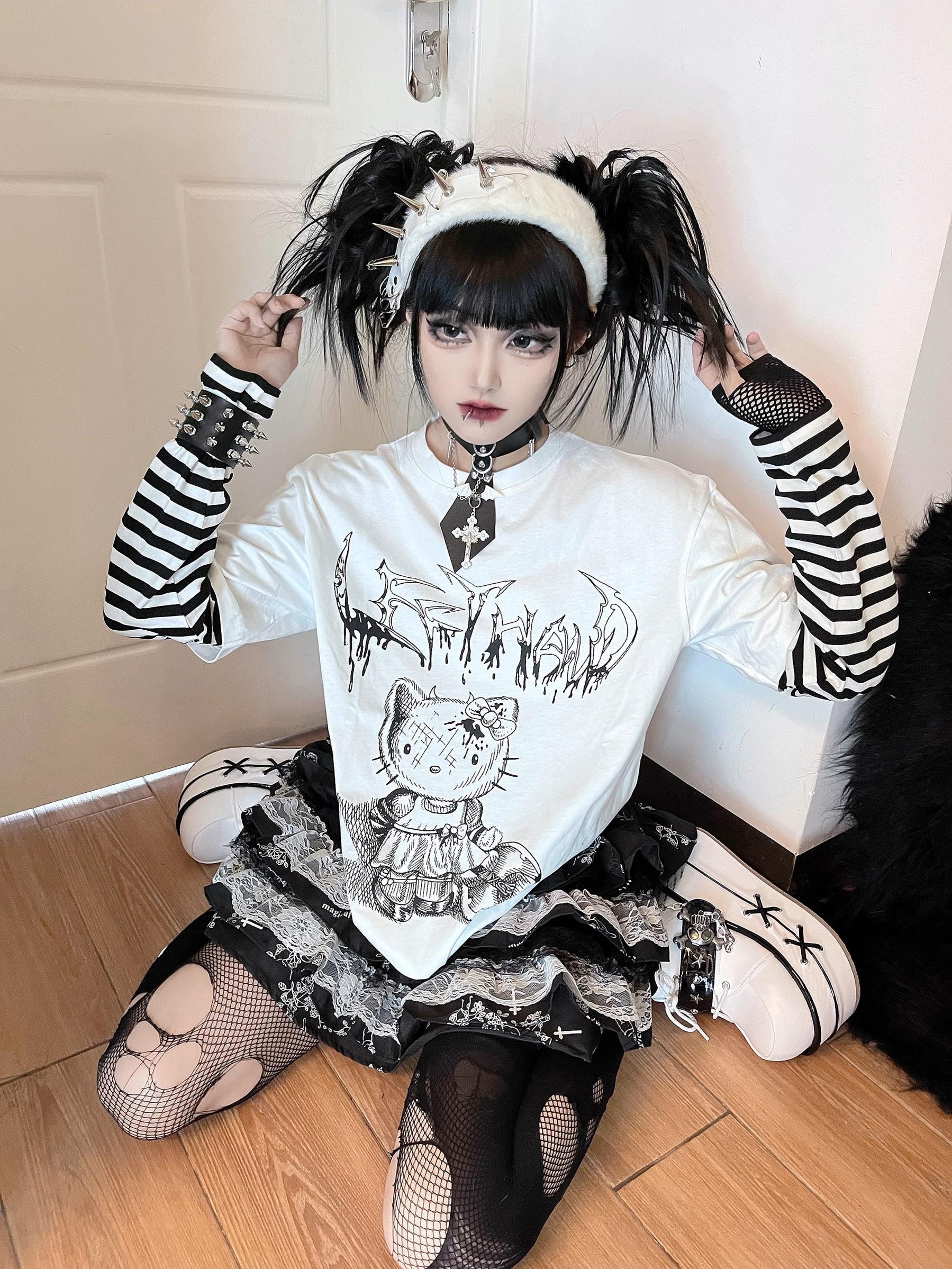 Jirai kei striped false two-piece long sleeve punk graphic tee anime character design close-up detail shot