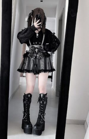 Punk goth fashion coordinate featuring sheer tulle skirt, floral waist decoration, Jirai Kei cardigan, and combat boots in indoor hallway