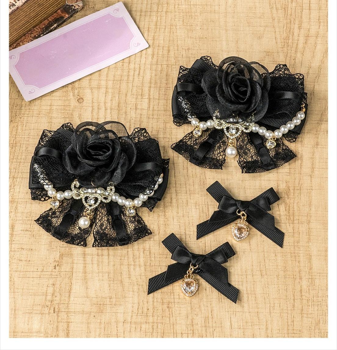 Flat lay top-down view of complete Jirai Kei hair accessories set on wooden table with pink card