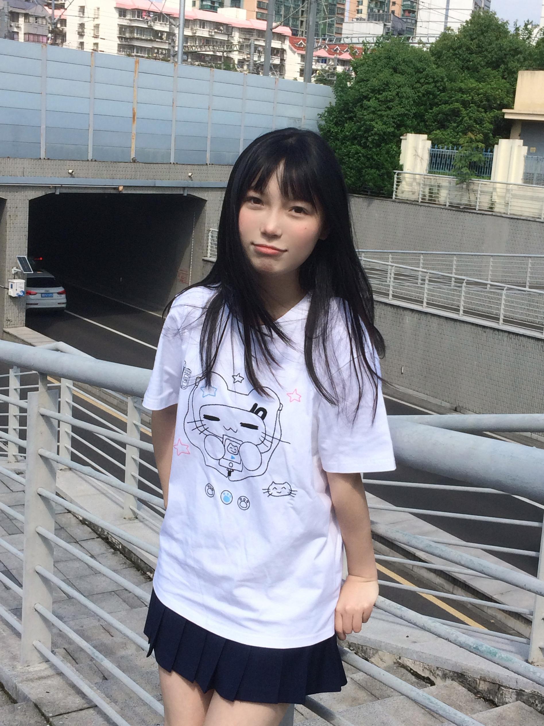 Jirai Kei aesthetic styling guide showing navy cat headset graphic T-shirt with layering options and accessory coordination