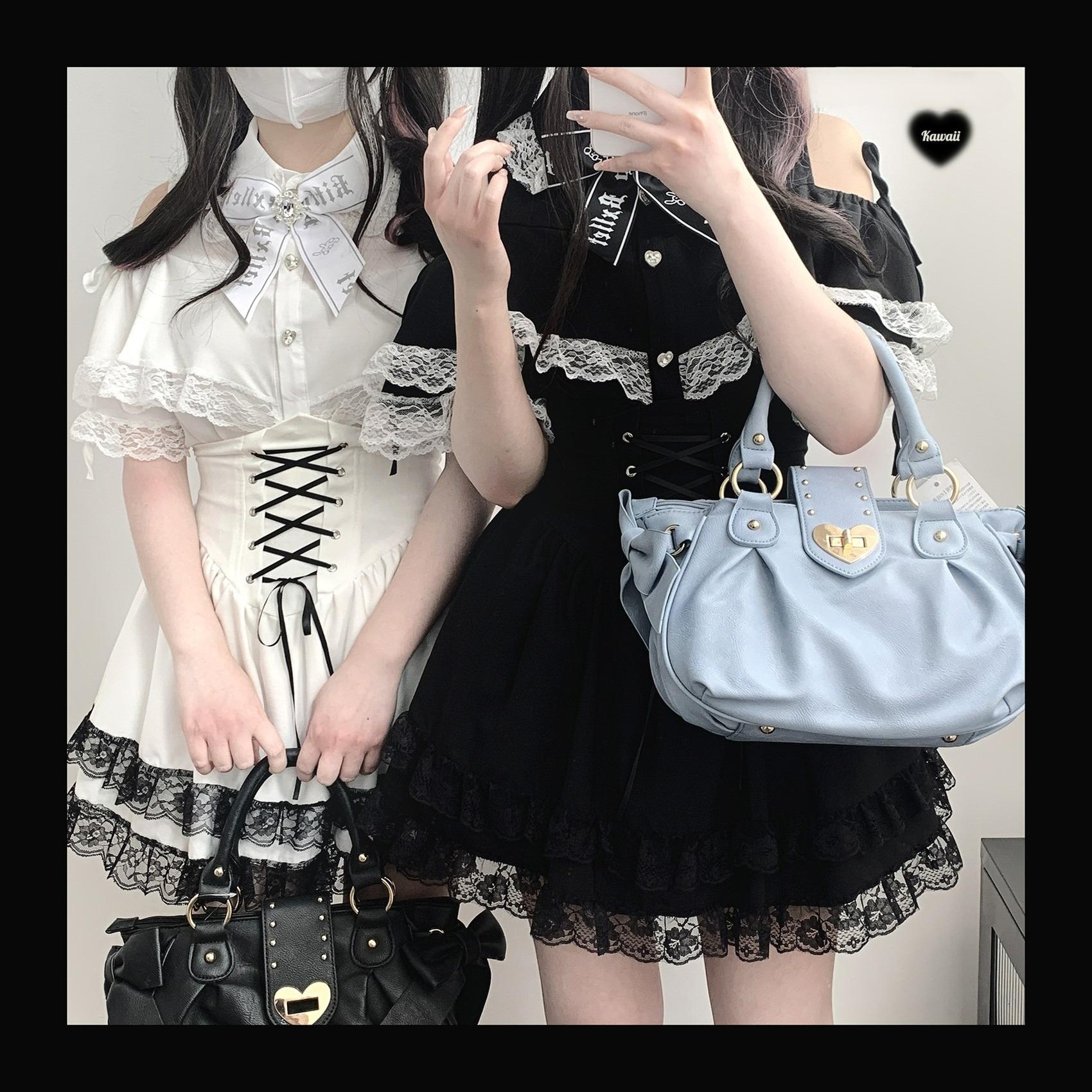 Two models wearing white and black Jirai Kei lace off-shoulder blouses with lace trim skirts and bow tie accessories