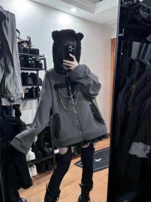 Oversized gray Jirai Kei cat ear hoodie jacket with detachable silver chain decoration, fuzzy black ear hood, front mirror selfie view worn by goth model in fitting room