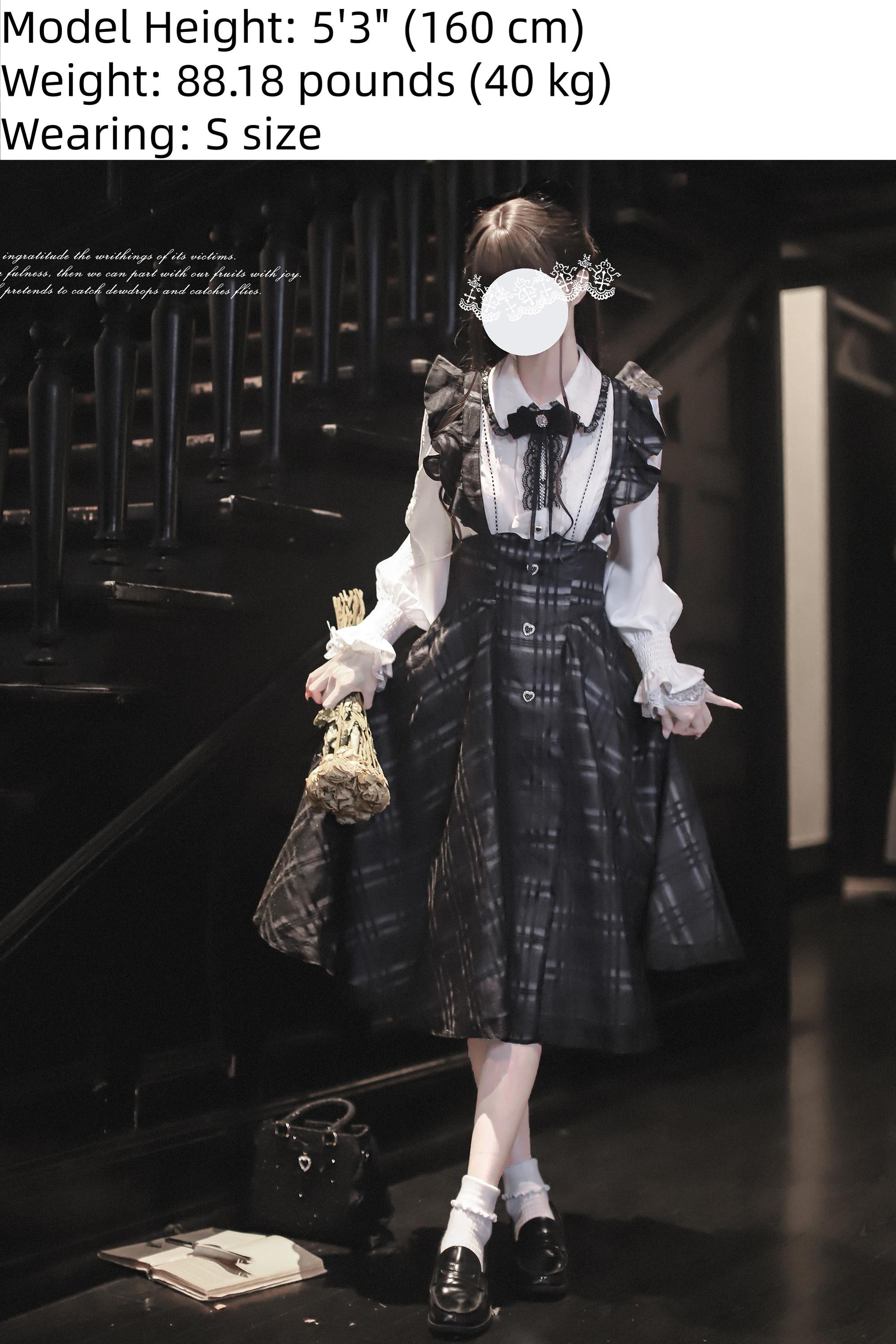Seiso Kei two-piece gothic lolita inspired outfit side view showing flared plaid skirt and matching white blouse, model on vintage stone paved street background