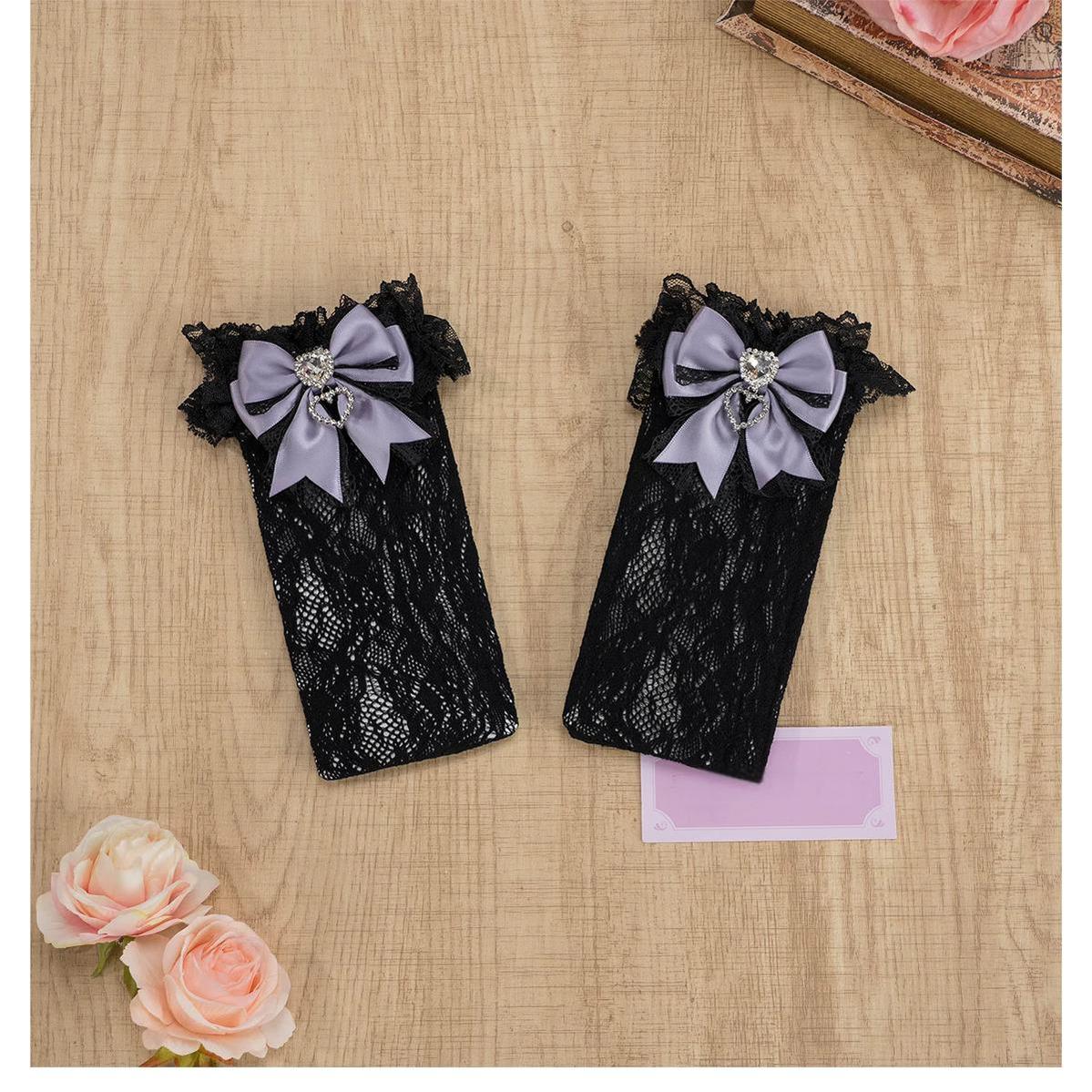 White ruffled lace knee-high Jirai Kei socks with white bow decoration, heart rhinestone embellishment, delicate floral lace pattern