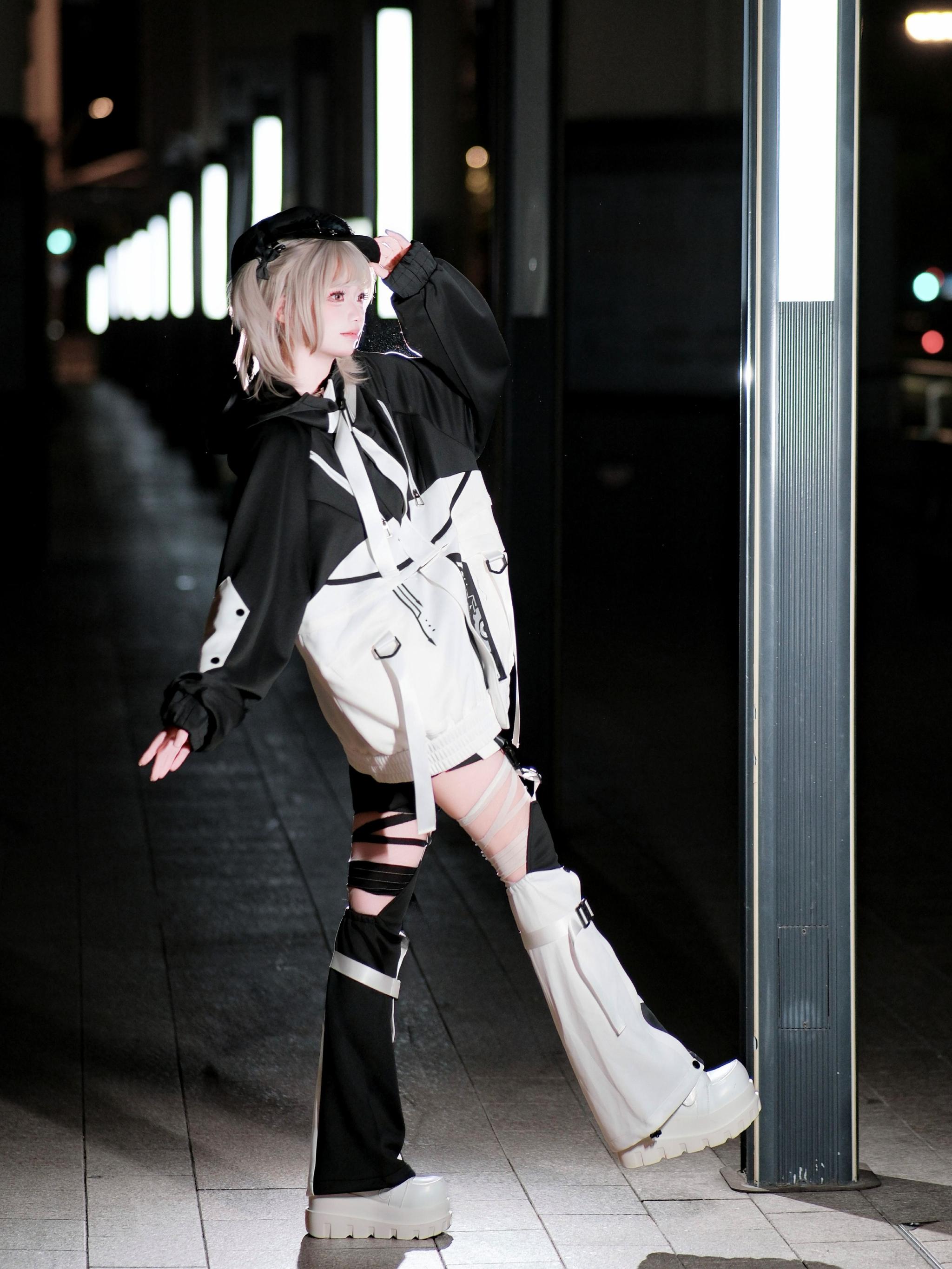 Cyberpunk jirai kei outfit flat lay showing complete set components jacket shorts leg warmers color coordination system