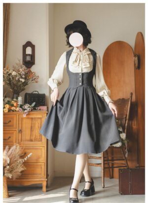 Vintage corset Lolita dress with beige ruffled blouse front three-quarter view classic grey pleated skirt