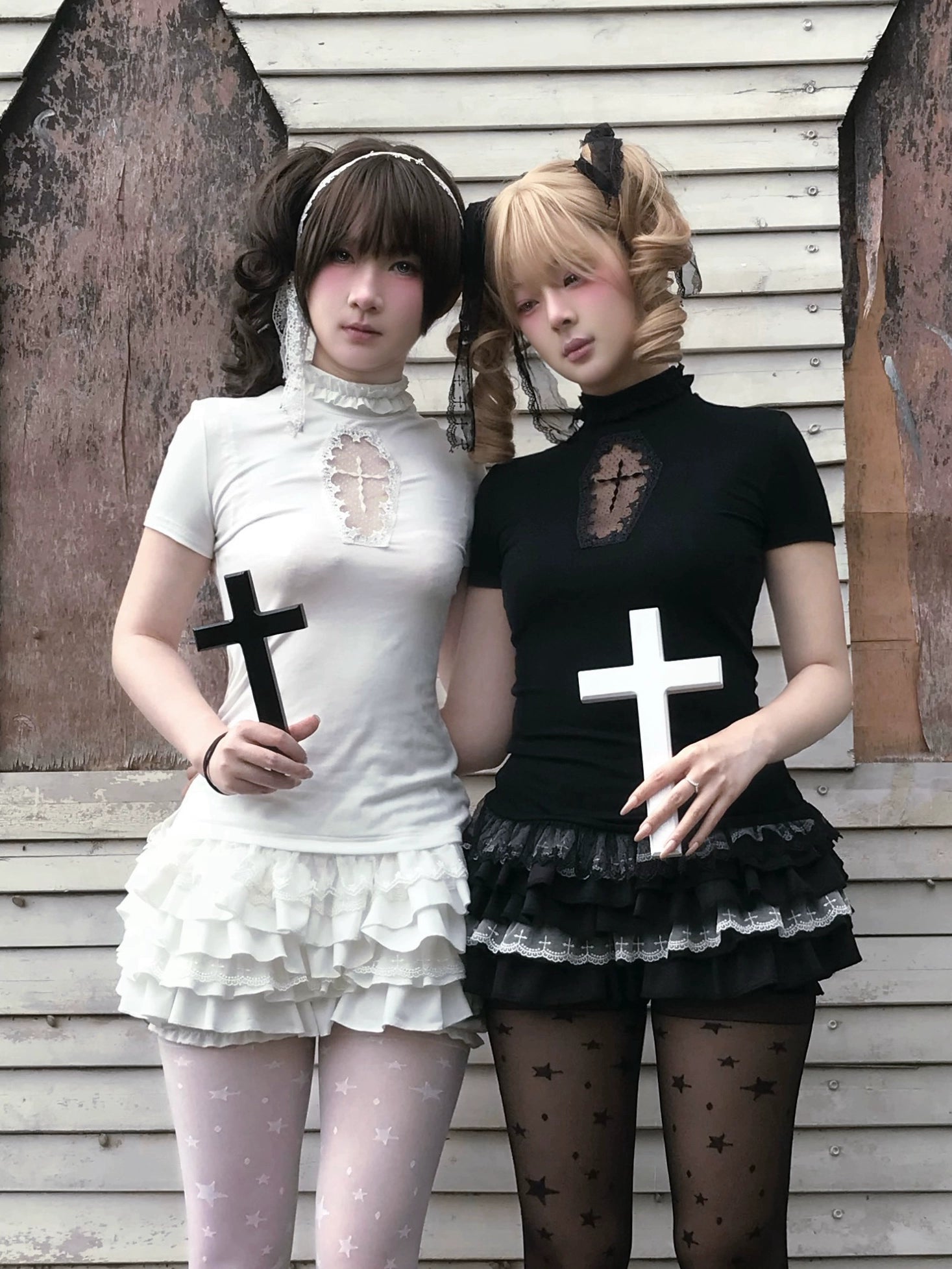 Black and white gothic Jirai Kei outfit set front view with cross props showcasing color options