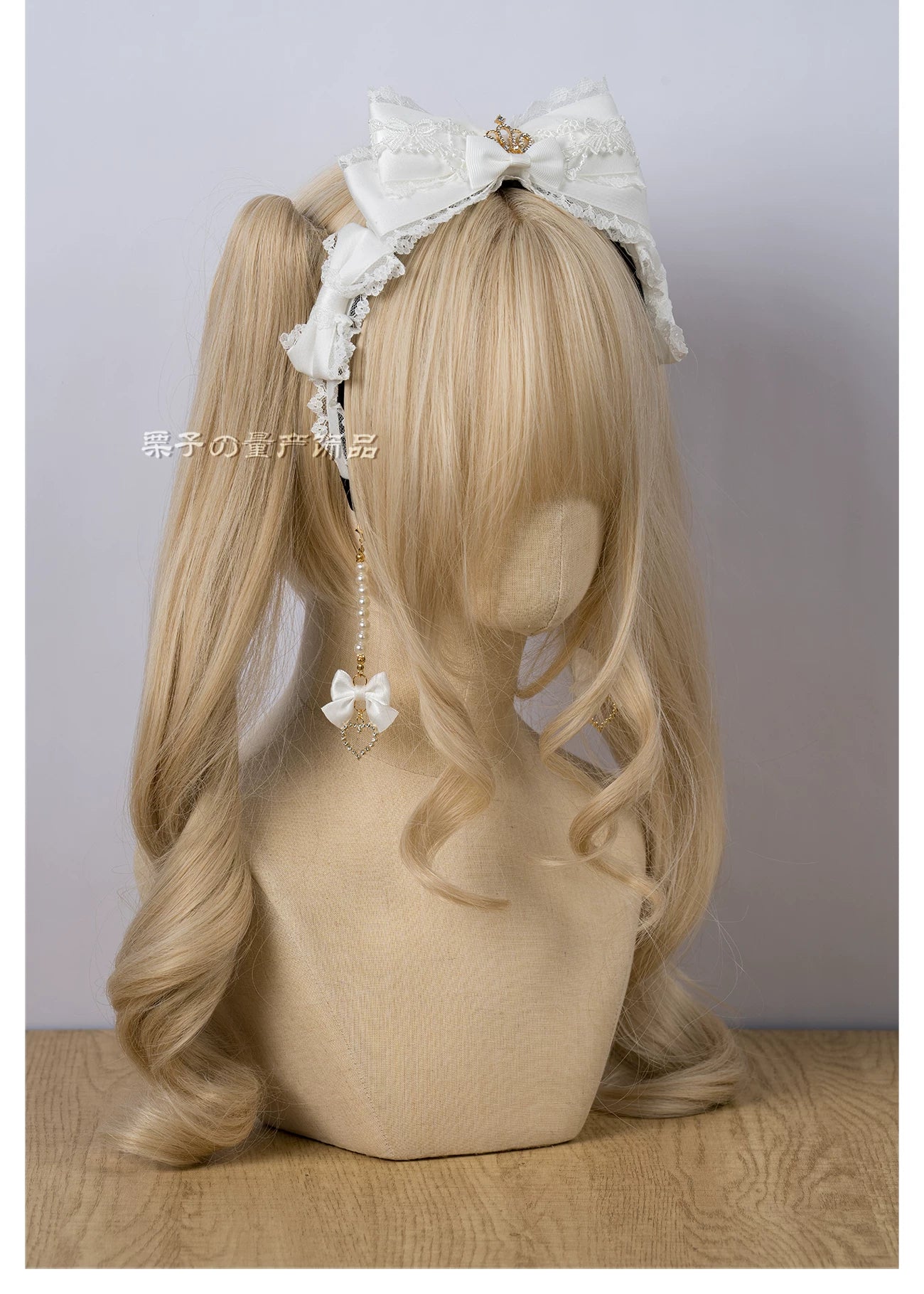 Navy blue bow KC Jirai Kei hair clip worn styling demonstration mannequin detail view