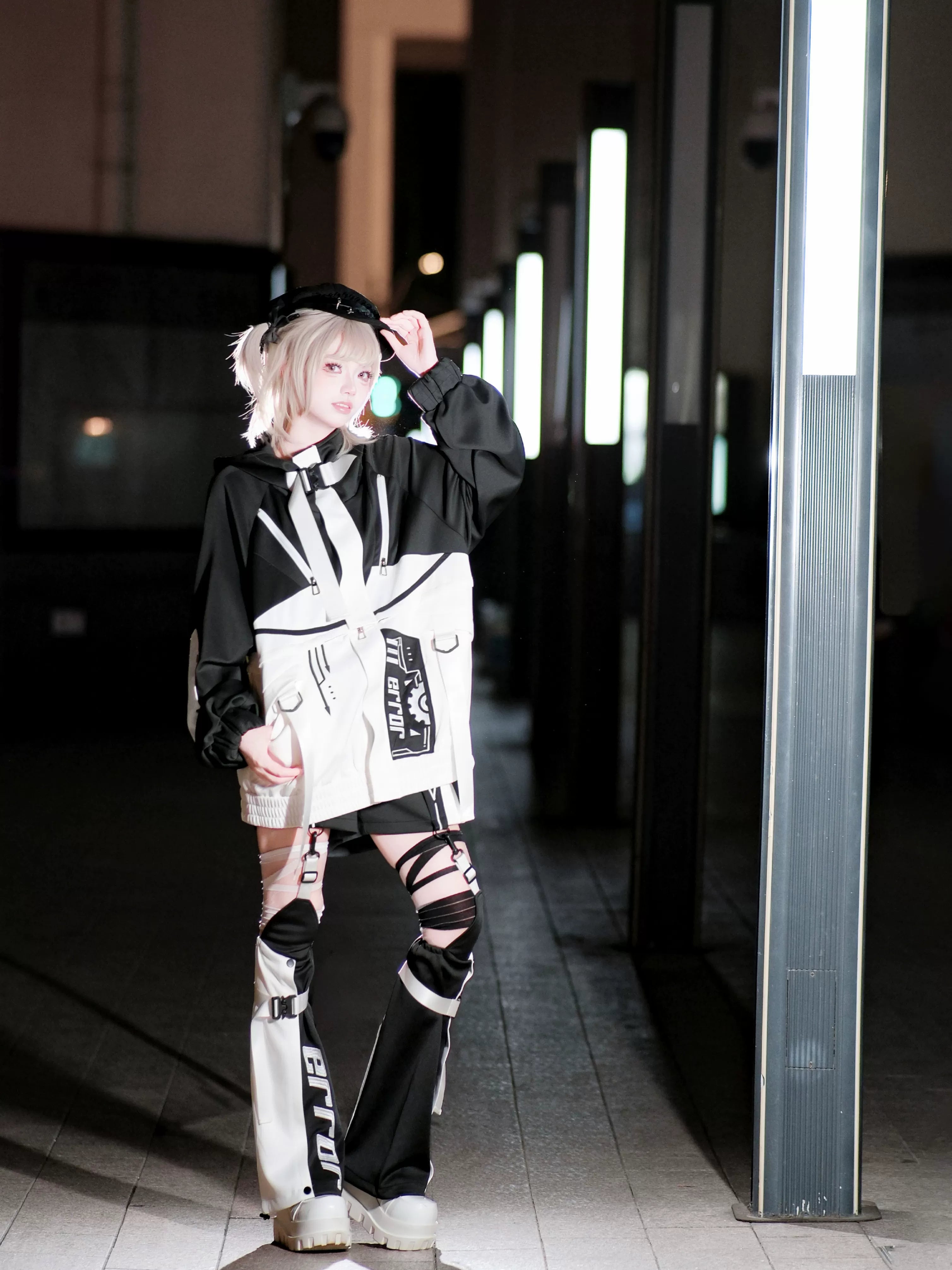 Cyberpunk jirai kei jacket detachable component close-up showing strap harness system color blocking and modular construction details